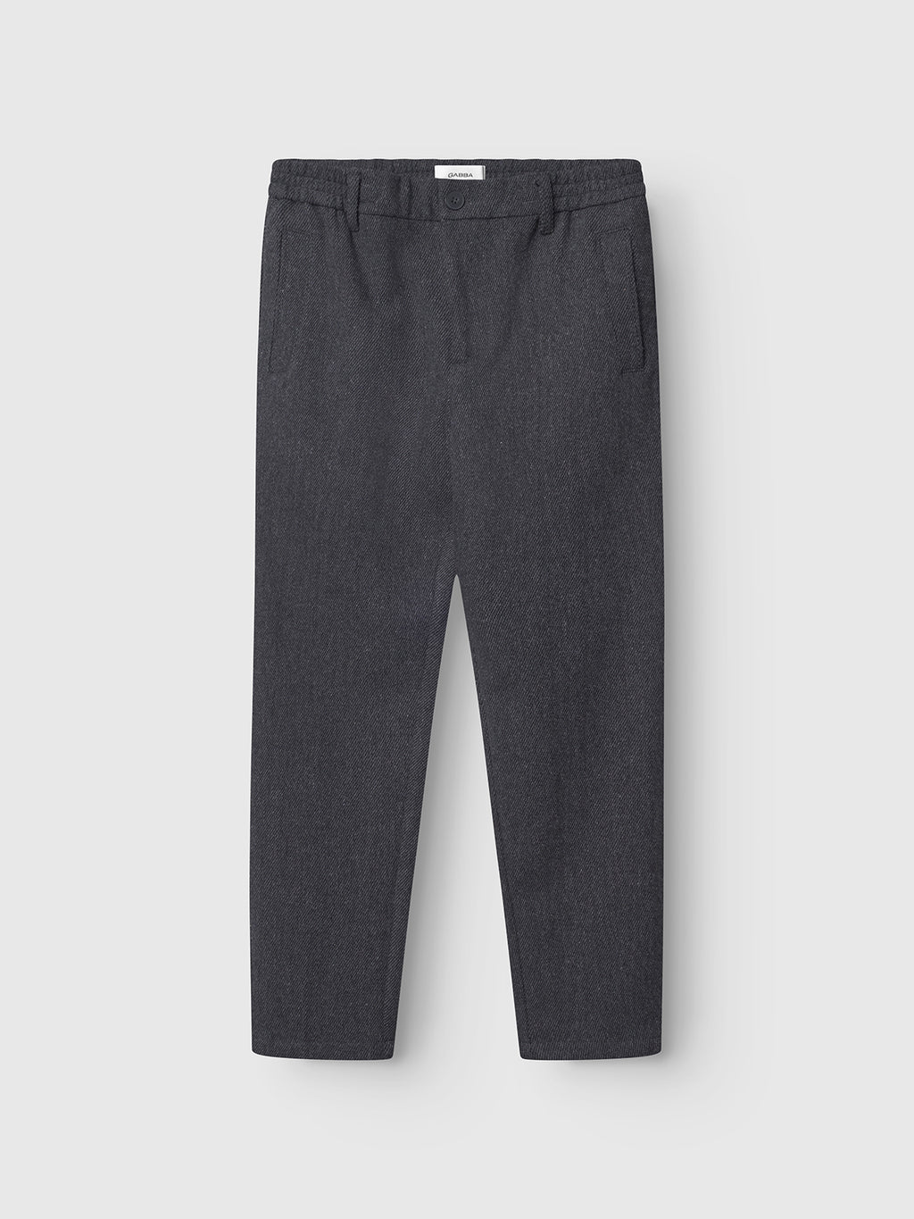The Gabba Monza Wook - Dk. Grey trousers feature an elasticated waistband, front pleats, side pockets, and a straight leg cut, shown flat on a light background.