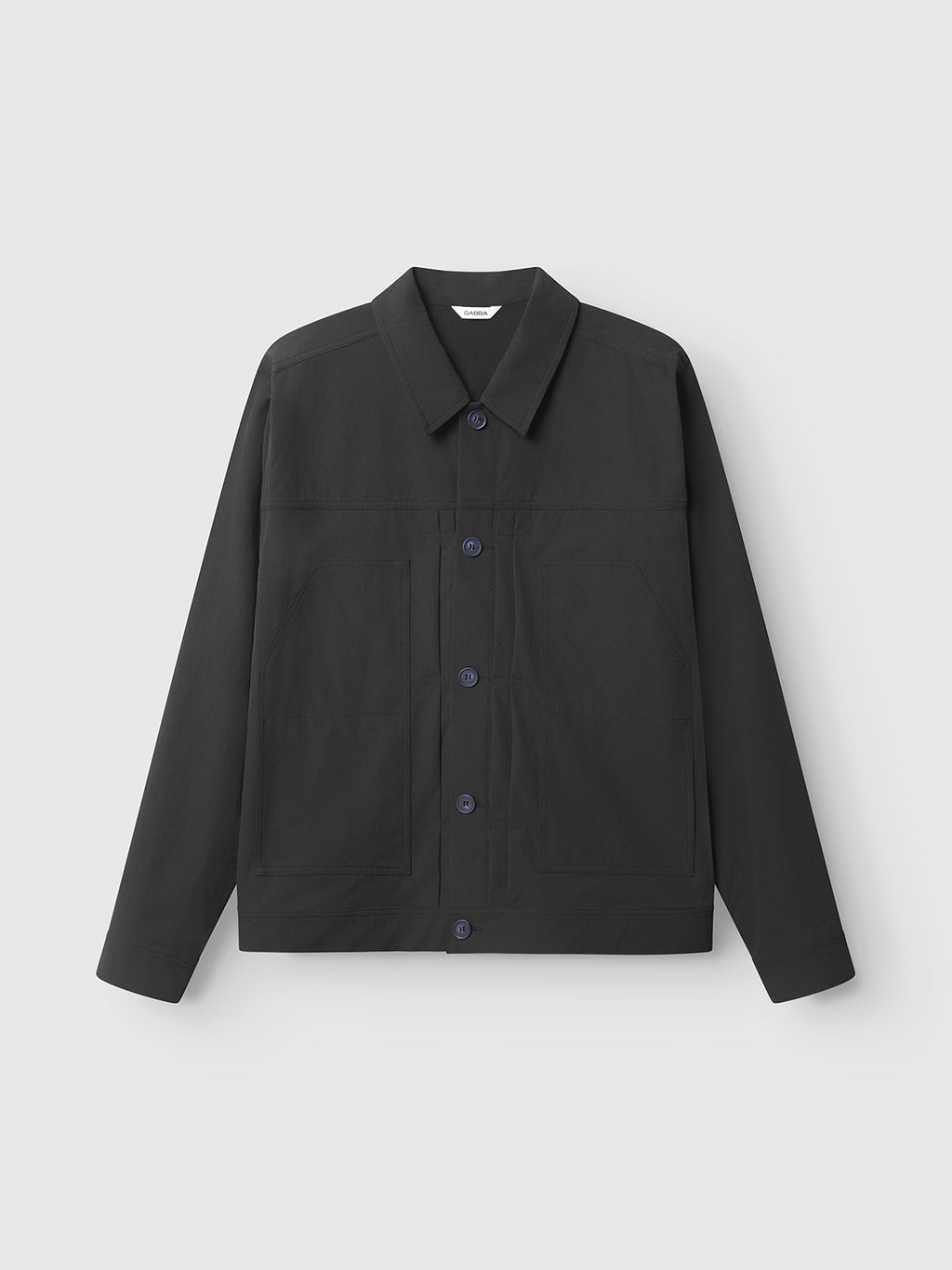 The Gabba Koy Tech - Black is a dark grey utility jacket in stretch tech fabric with a pointed collar, front patch pockets, and long sleeves, shown on a plain light grey background.