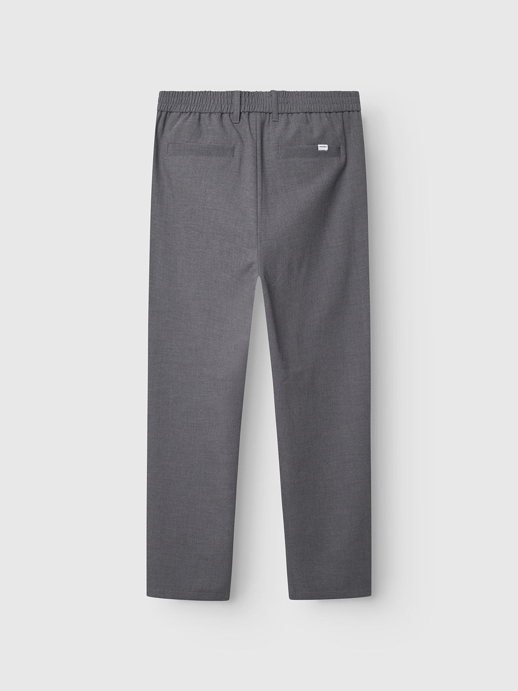 Back view of Gabba Napoli 19 Phin GRS - Dk. Grey trousers in a wool-viscose blend with straight-leg cut, elastic waistband, two back pockets, and a small white tag above the right pocket, shown on a light gray background.
