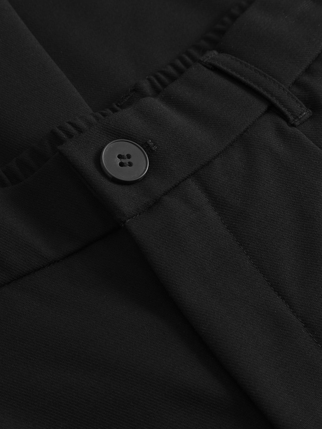 Close-up of Gabbas Napoli 19 Phin GRS - Black wool blend tailored trousers, highlighting the smooth, slightly textured fabric, waistband, belt loop, and black four-hole button at the front.