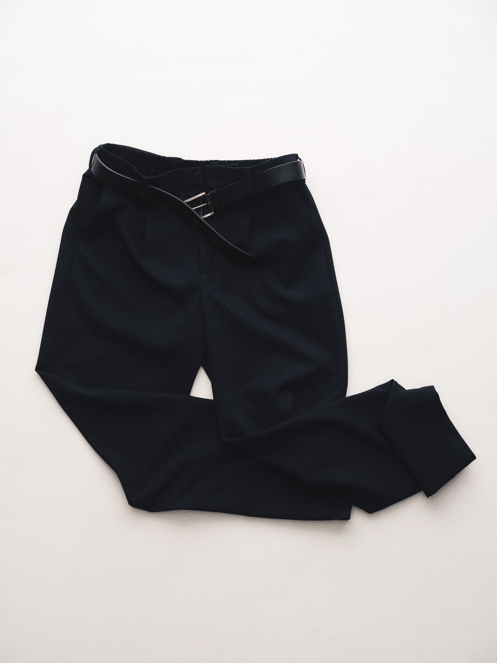 Gabba GABnapoli 19 Phin GRS - Blue Black wool blend chino dress pants in regular straight fit with a black belt, laid flat on a light surface with one pant leg slightly folded over the other.