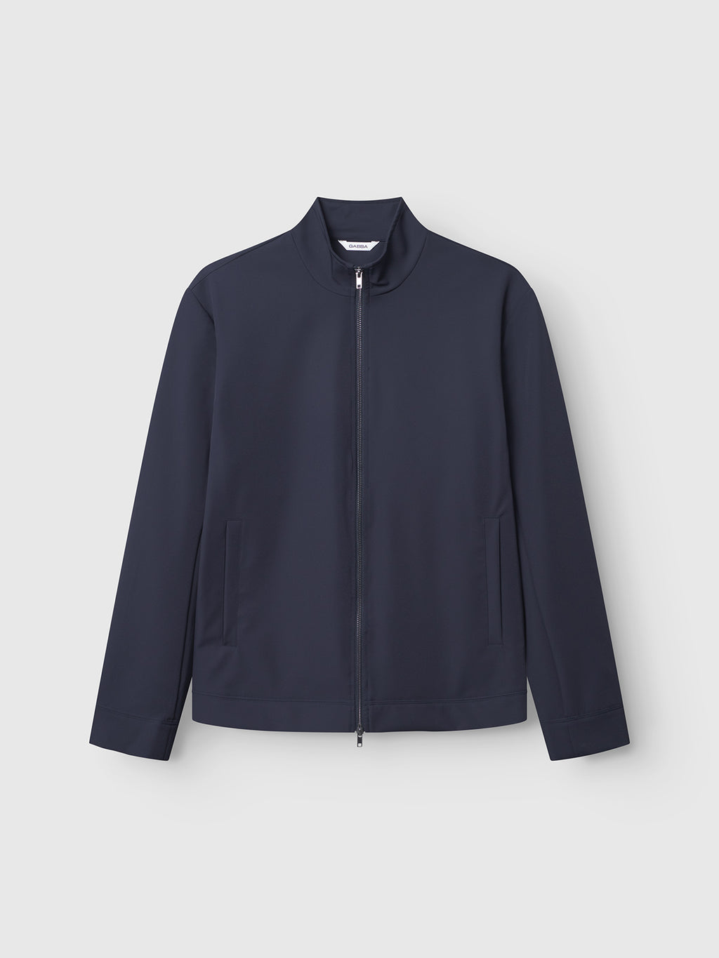The Gabba Nik Bascu - Navy is a lightweight, long-sleeve jacket with a front zipper, standing collar, and two side pockets, shown flat on a plain light gray background.