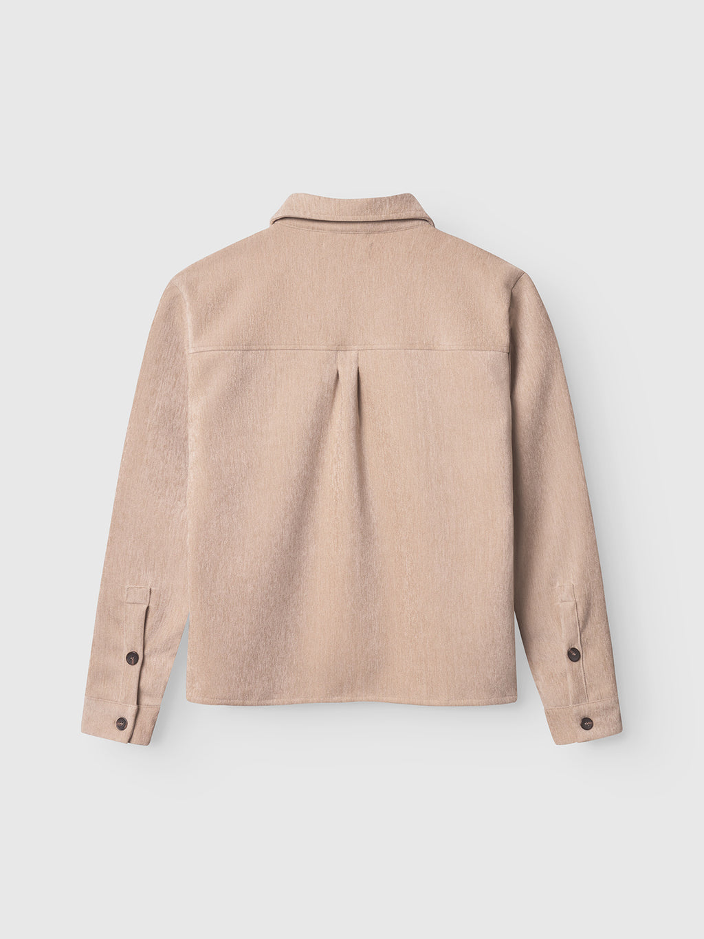 The Gabba Flap Velour - Lt. Sand overshirt is shown from the back, highlighting its straight hem, buttoned cuffs, spread collar, and a central pleat below the yoke. The soft fabric stands out against the plain white background.