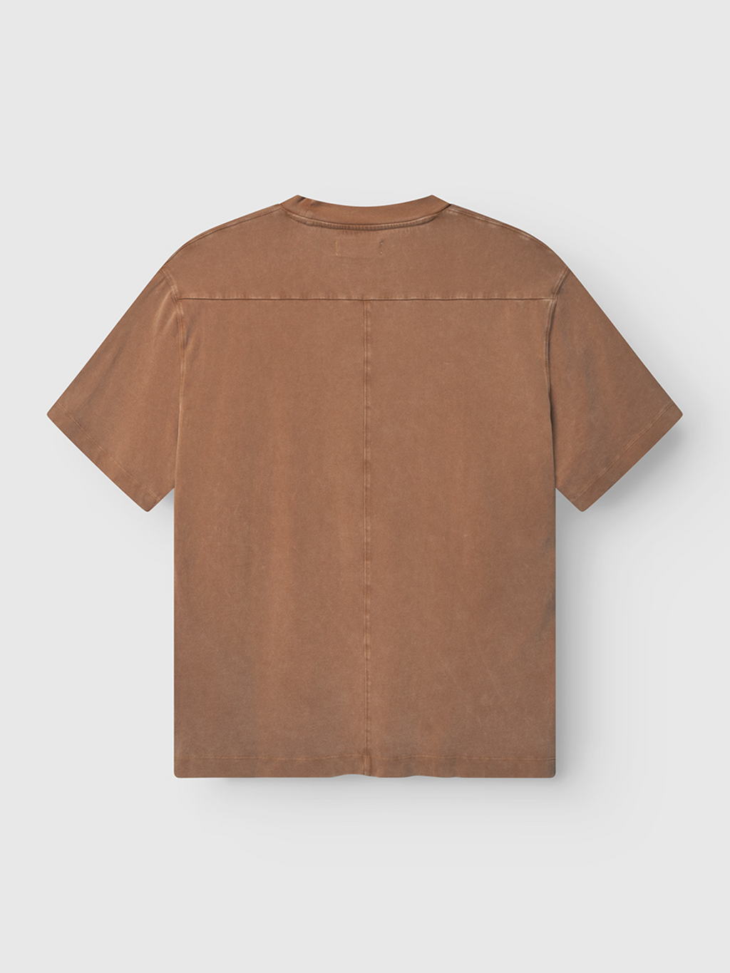 The Gabba Nigel Wix Boxy Peso SS in bronze brown is a durable cotton jersey short-sleeve tee with a subtle worn texture and a straight horizontal seam across the upper back, shown from the back.