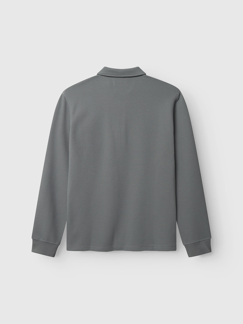 Back view of the Gabba Island Waff shirt in Dust Sage Green, featuring long sleeves and a textured waffle surface, laid flat on a white background. The shirt has a clean, pattern-free design with no visible logos.
