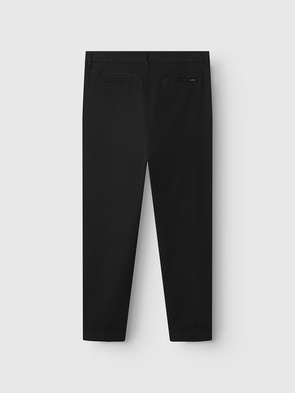 The Gabba Joe-Pas Vill - Black dress pants are shown from the back, featuring a tailored cotton twill fabric, straight-leg cut, and two subtly stitched back pockets against a light gray background.