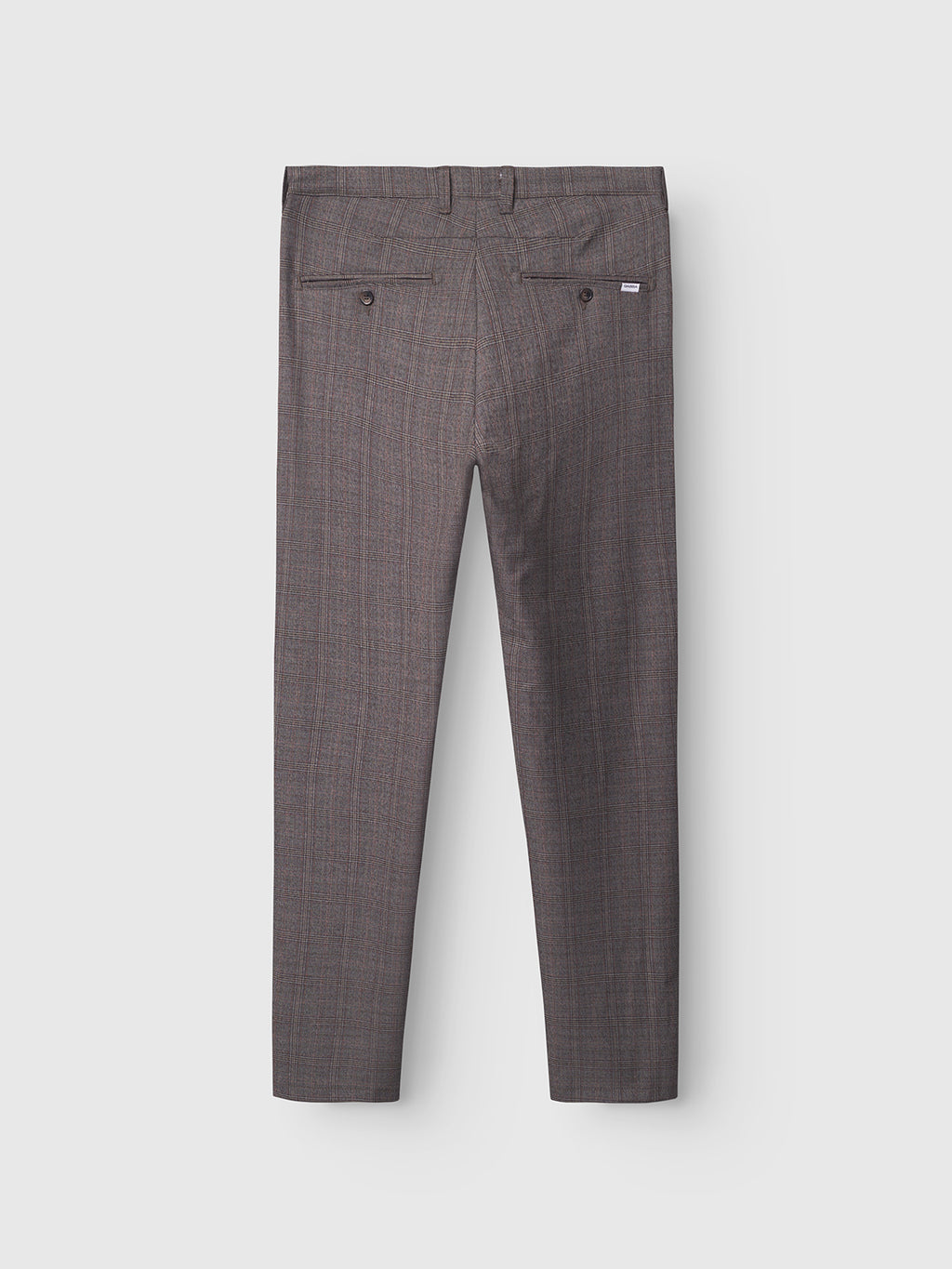 Back view of Gabba Paul Tinun - Brown Check pants with stretch comfort, two buttoned back pockets, a small label above the right one, and slim straight legs, displayed on a light grey background.