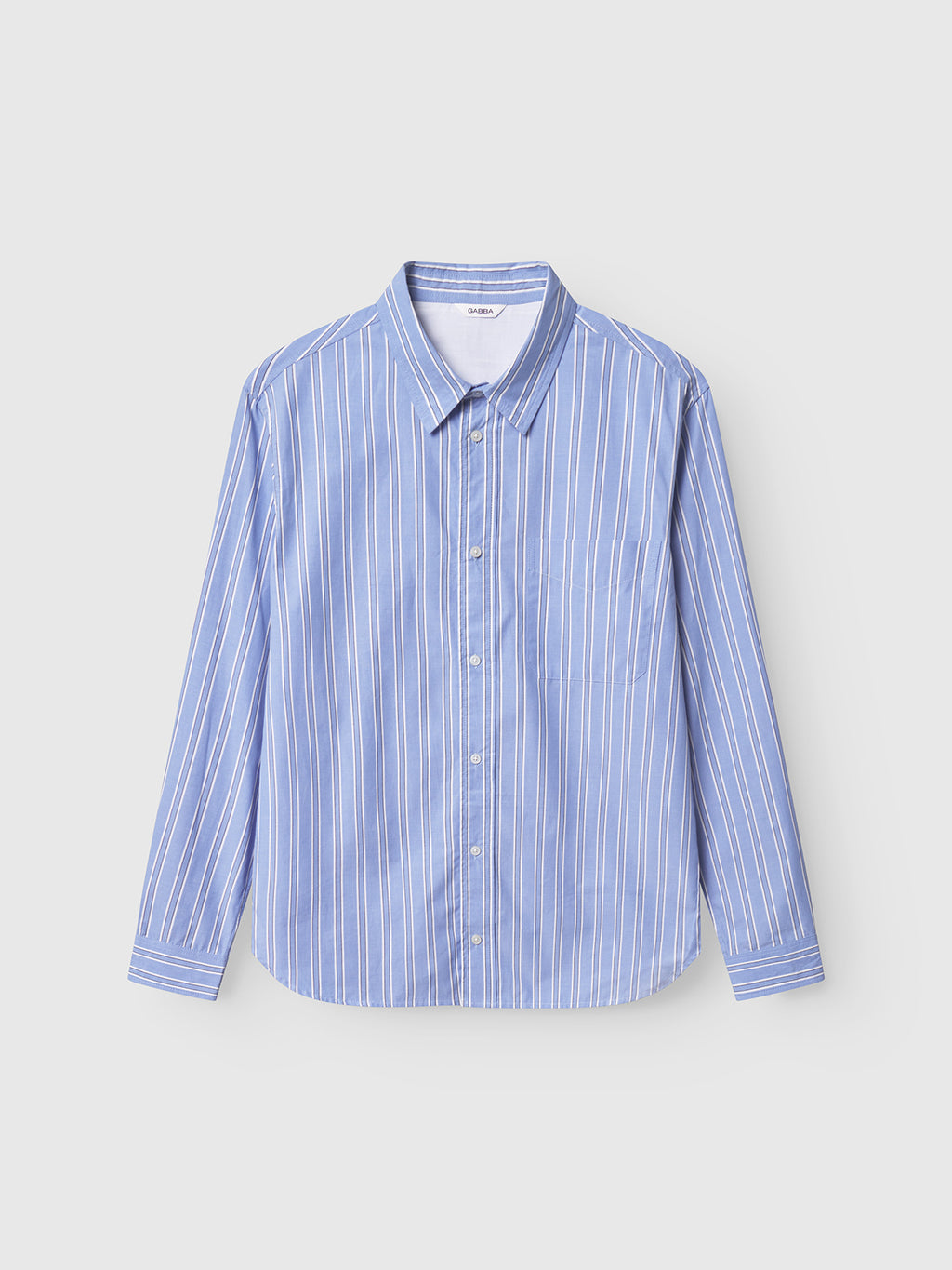 The Gabba Sven Reg Clo Ls - Blue Stripe features a classic collar, button-down long sleeves, and a chest pocket. Made from 100% cotton, it’s shown against a plain light background.