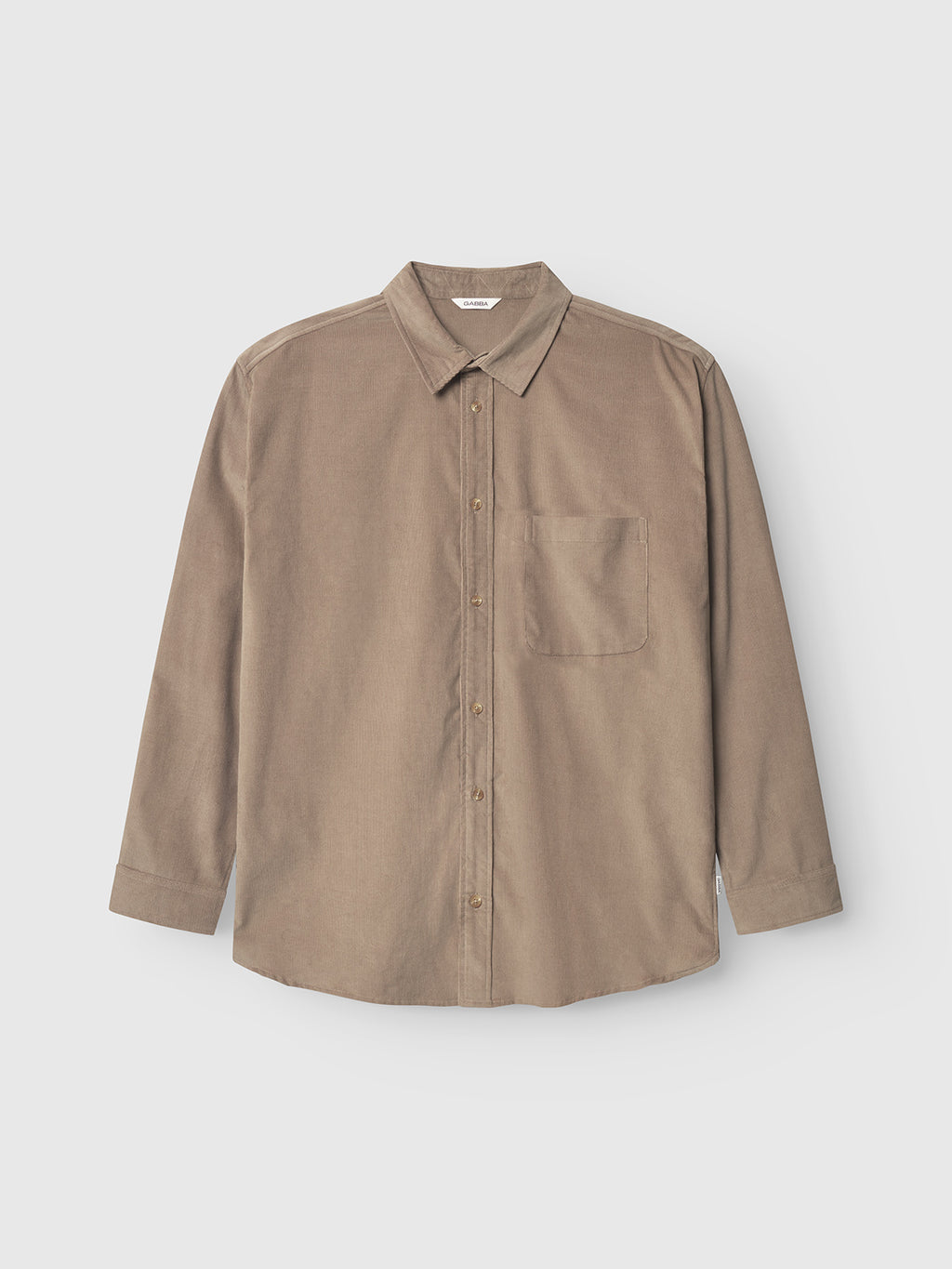 The Gabba Jens Over Cord LS in Sand Greige is a long-sleeve, button-up corduroy overshirt with a chest pocket, shown against a plain white background.