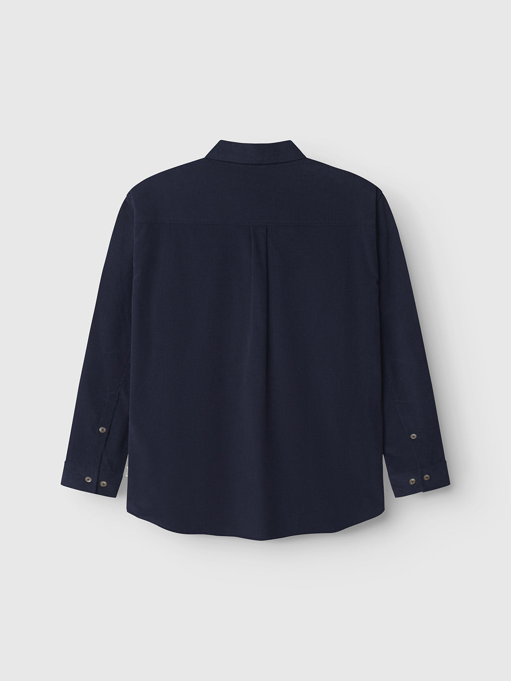 The Gabba Jens Over Cord LS - Night Sky is a long-sleeve, dark navy corduroy overshirt with buttoned collar and cuffs, shown from the back against a light background—an ideal stylish layering piece for any season.