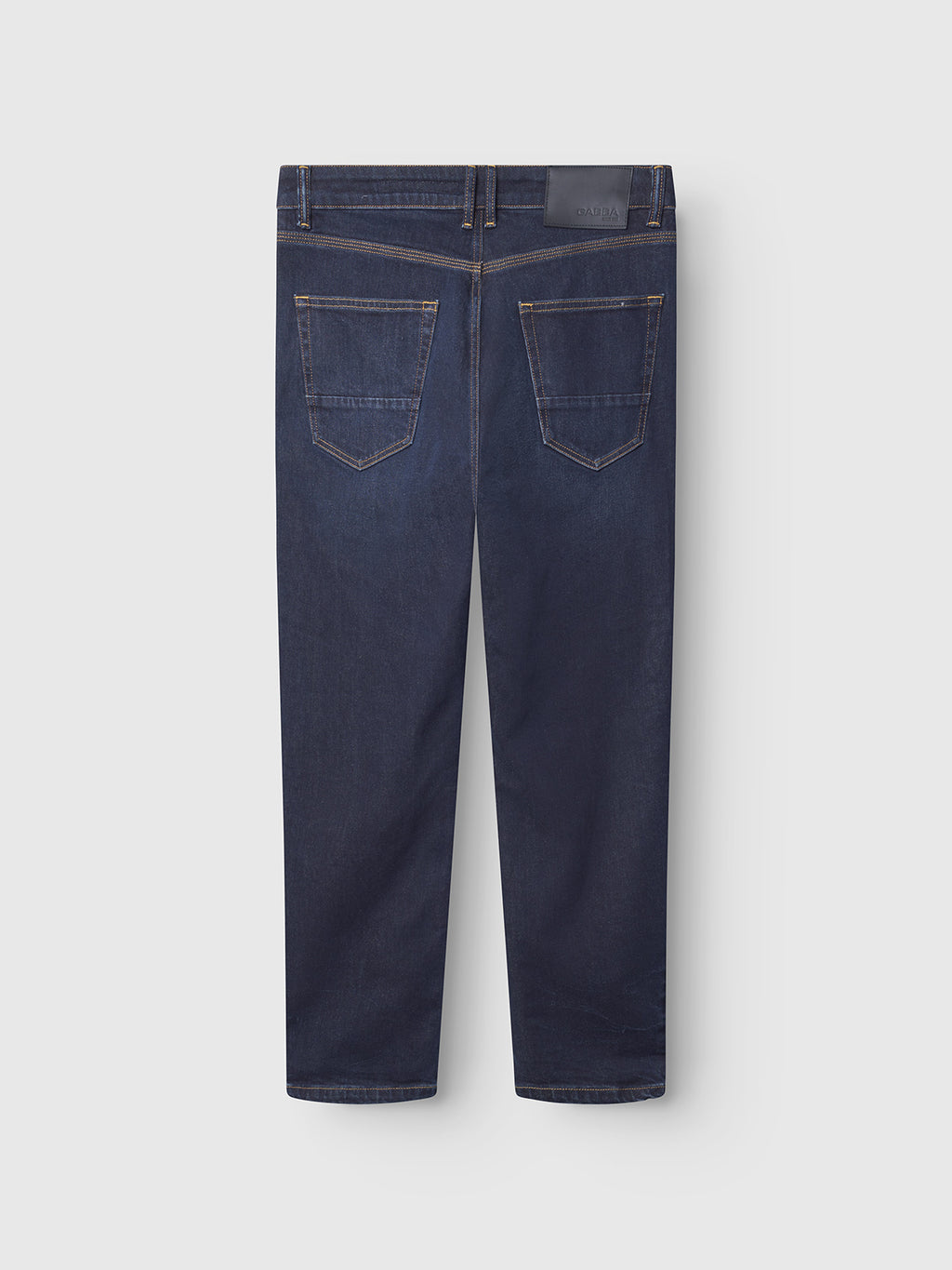 Gabbas Carl Willo - Mid Blue Denim jeans in comfort stretch feature two stitched rear pockets and a black leather waistband patch. The Japanese-inspired mid blue wash stands out against the plain light background.
