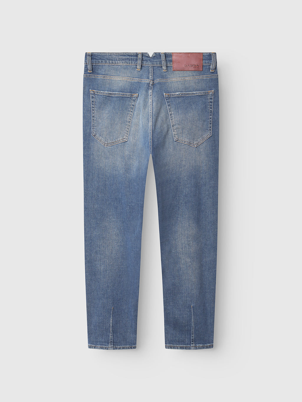 Back view of Gabba Alex Ulio mid blue denim jeans featuring two back pockets, belt loops, a brown leather patch, stretch comfort, straight-leg fit, and subtle faded detailing.