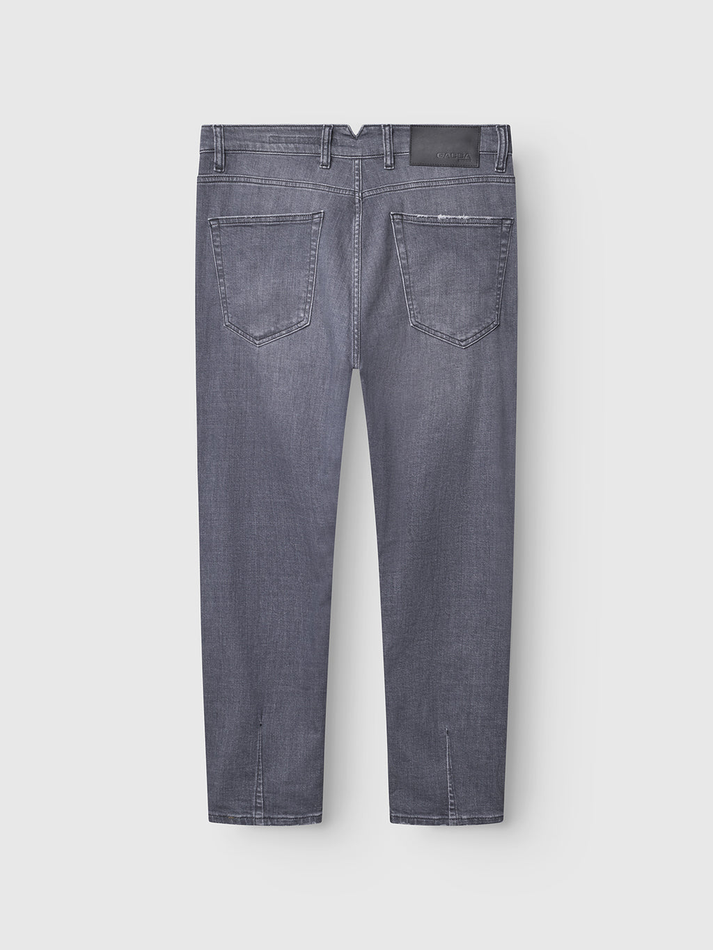 Back view of Gabbas Alex Sotto - Grey Denim relaxed tapered jeans, featuring two back pockets, visible stitching, and a black leather patch on the waistband. Made from stretch cotton for comfort. Photographed against a light gray background.