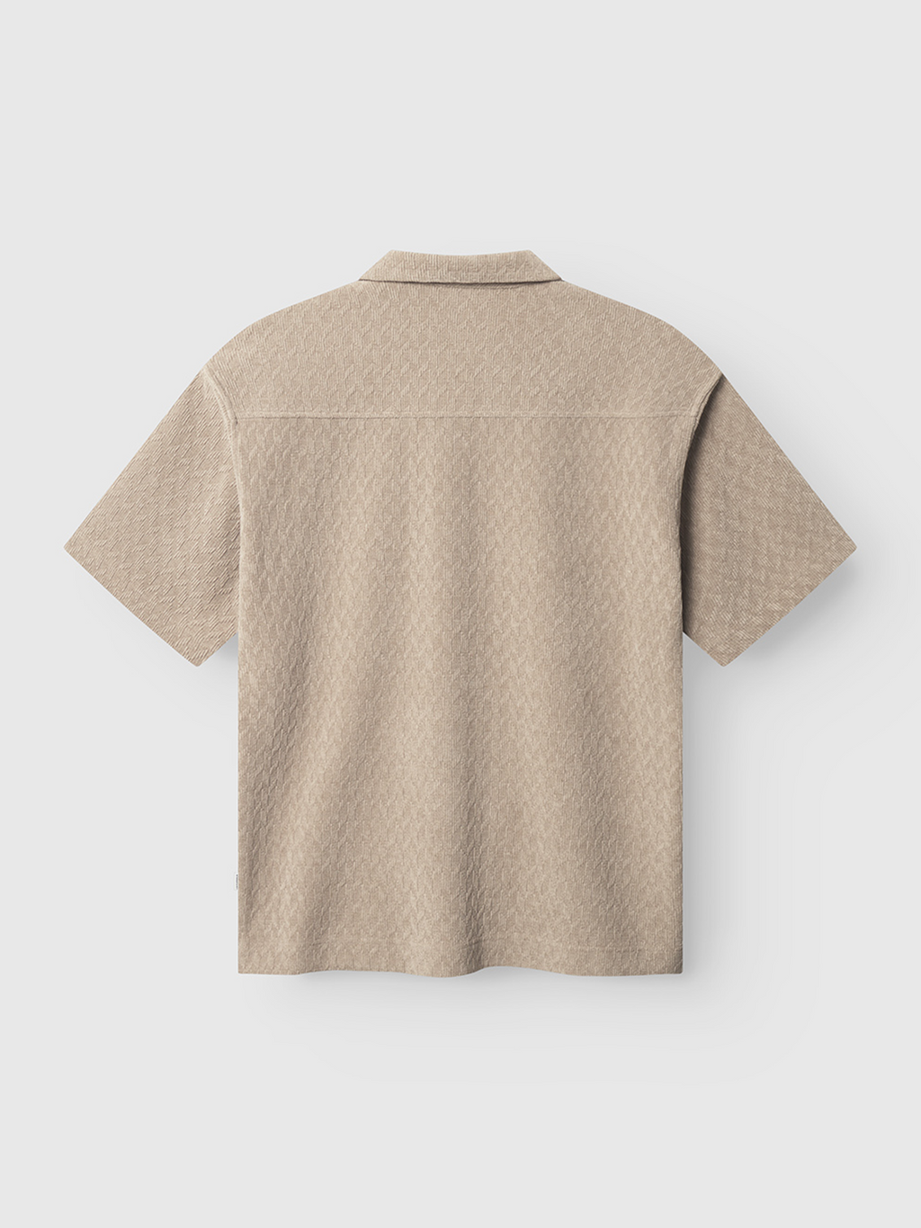 The Jens Over Diam SS - Sand by Gabba is shown from the back, highlighting its subtle textured pattern on lightweight beige fabric, set against a plain white background.