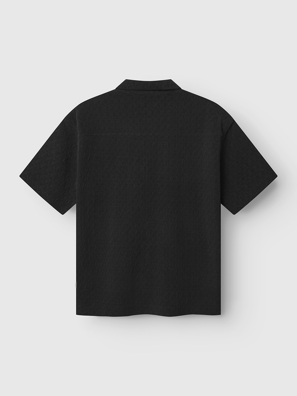 The Gabba Jens Over Diam SS - Black shirt features short sleeves, black diamond jacquard velvet, a straight hem, and a classic collar, shown from the back on a plain white background.