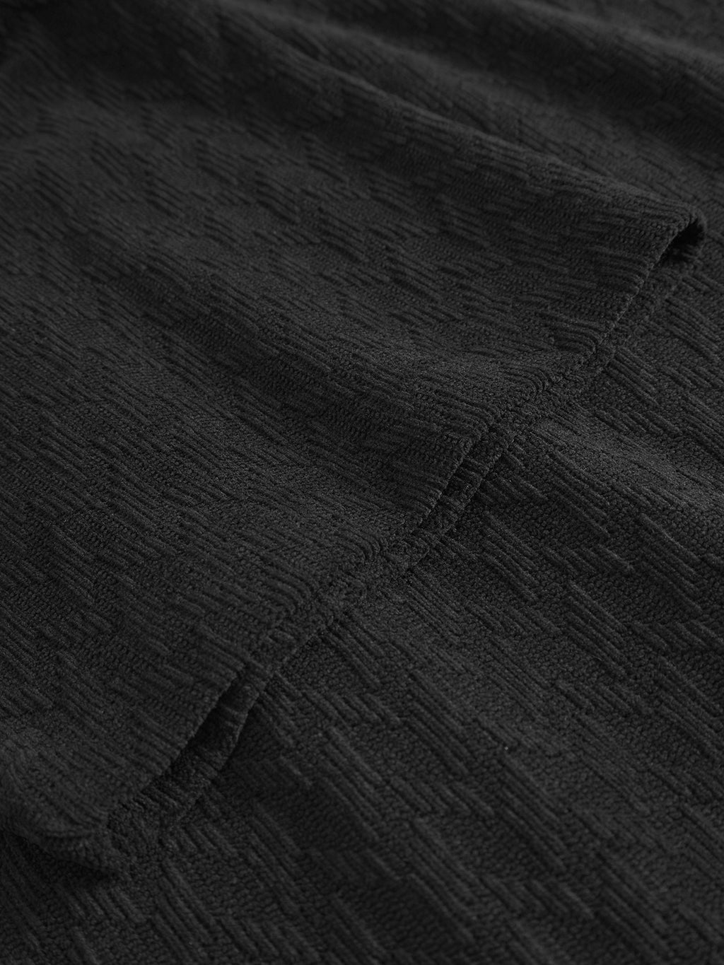 Close-up of Gabbas Jens Over Diam SS - Black, showcasing diamond jacquard velvet fabric with a subtle geometric pattern and visible seam stitching, highlighting the shirts intricate design and craftsmanship.