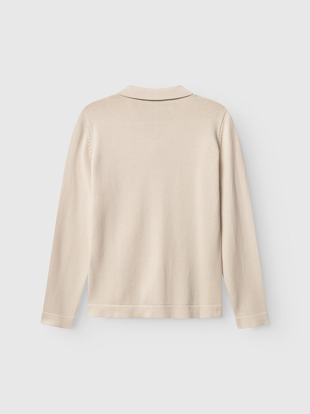 The Gabba Sakai Wong LS in White Almond, a beige long-sleeve resort collar cardigan made from 100% cotton, is displayed flat against a plain white background, shown from the back for a modern look.