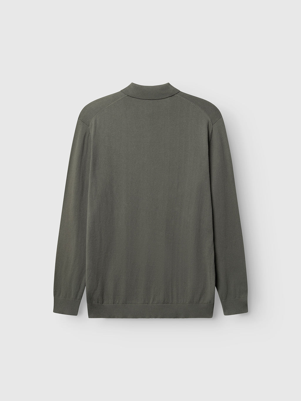 The Gabba Akita Prex LS in Dust Sage Green is shown from the back, highlighting its ribbed collar, cuffs, and hem. Made from a soft cotton-cashmere blend, this long-sleeve polo sweater stands out against a light gray background.