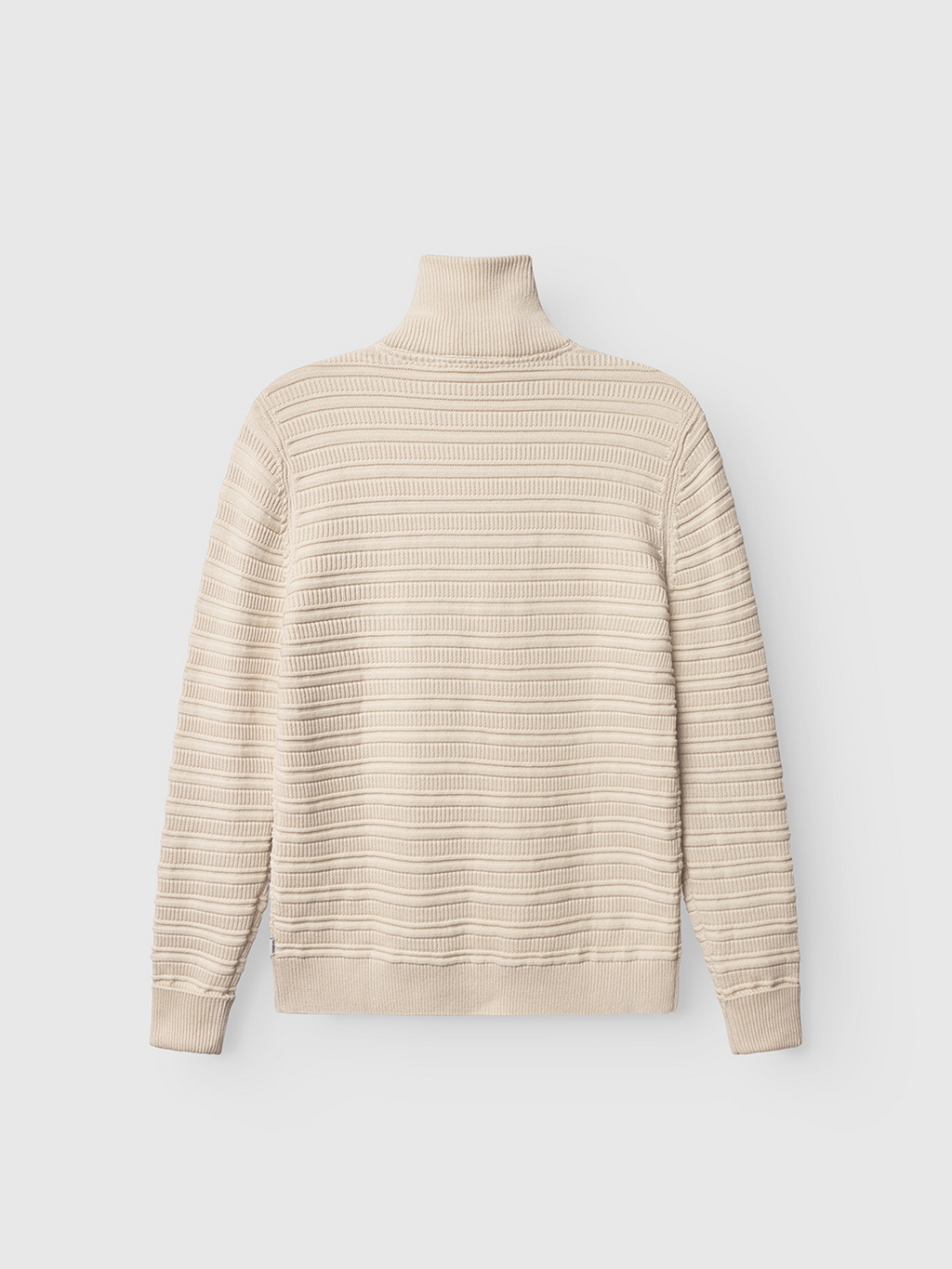 Back view of the Gabba Iwaki Buco LS sweater in White Almond, featuring a cream ribbed knit with horizontal stripes, long sleeves, and a turtleneck, shown on a plain white background.