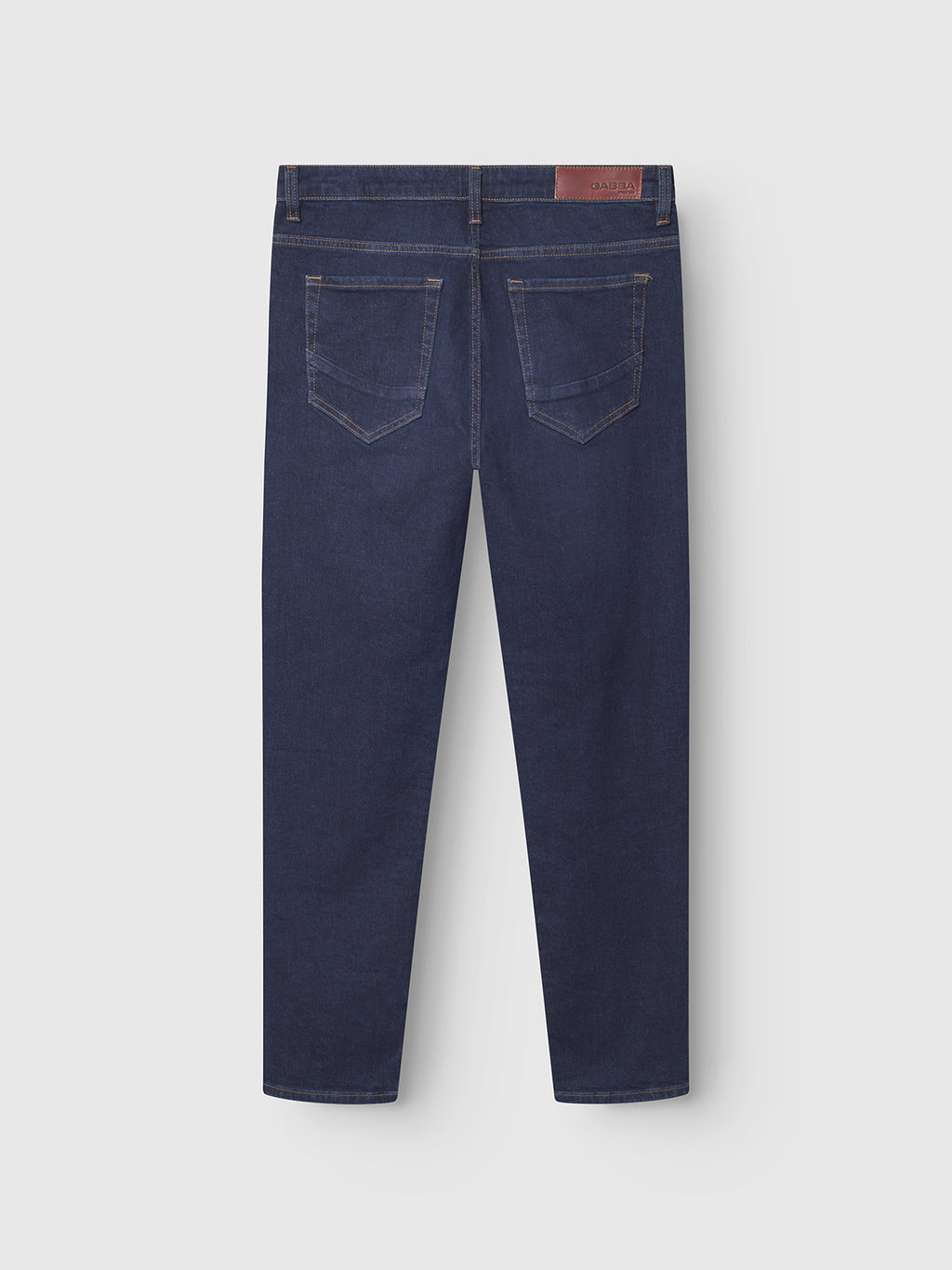 The Gabba Marc Jingo - Dark Blue Denim jeans are shown from the back with comfort stretch, two rear pockets, brown stitching, and a brown leather patch on the waistband.