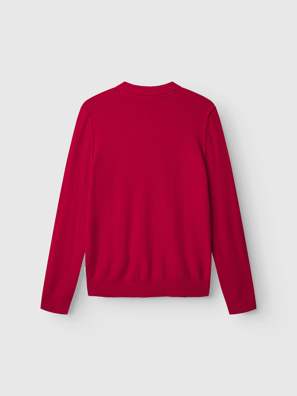 The Gabba Tokota Aico LS - Red is a plain, long-sleeved Merino wool sweater shown from the back against a light gray background, featuring a modern knit with ribbed neckline, cuffs, and hem.