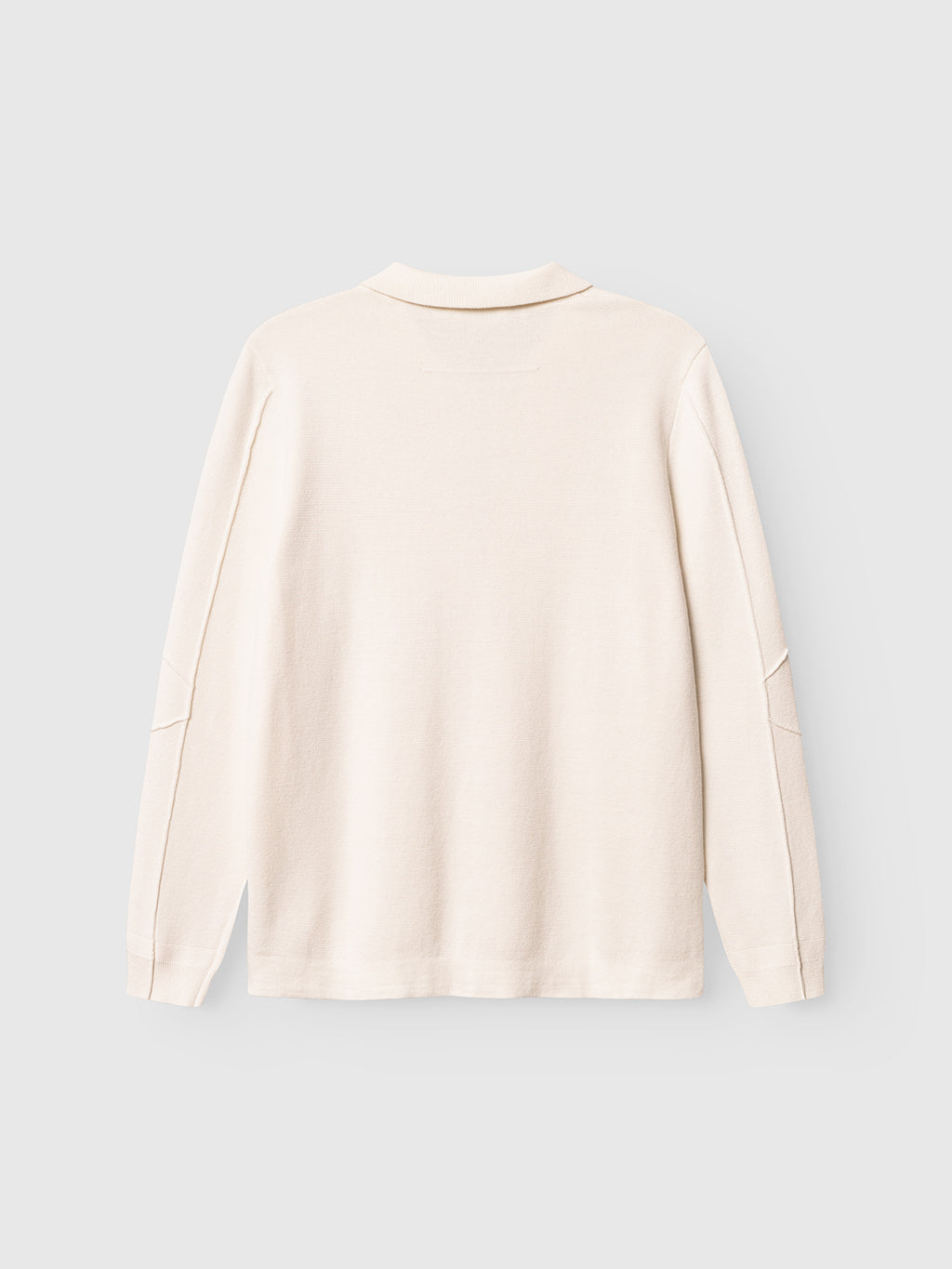 The Gabba Blanko New Zip LS in off white is a long-sleeve men’s sweater with a relaxed fit and minimalistic design, crafted from a cotton-wool blend. Shown from the back on a light gray background.