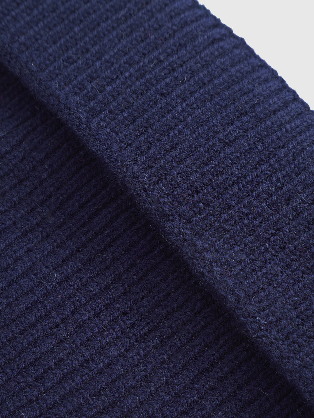Close-up of Gabbas Biella Aico - Navy showing ribbed, navy blue knit with a folded edge—highlighting the cozy detail of this merino staple for cold weather.