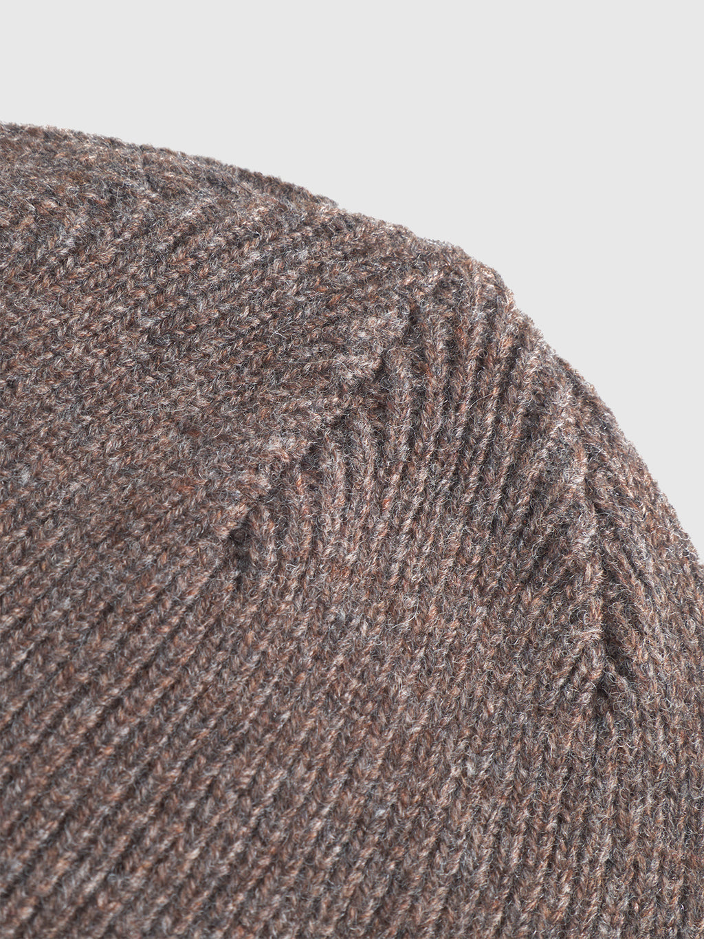 Close-up of the Biella Aico - Dk. Brown ribbed merino beanie by Gabba, showing its 100% wool texture and seam details against a plain background—ideal for any cold-weather look.