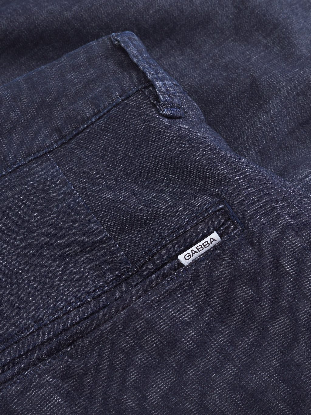 Close-up of a back pocket on Gabba Firenze Sisu - Dark Denim relaxed tapered jeans, with a small white fabric label reading GABBA stitched near the pocket opening.