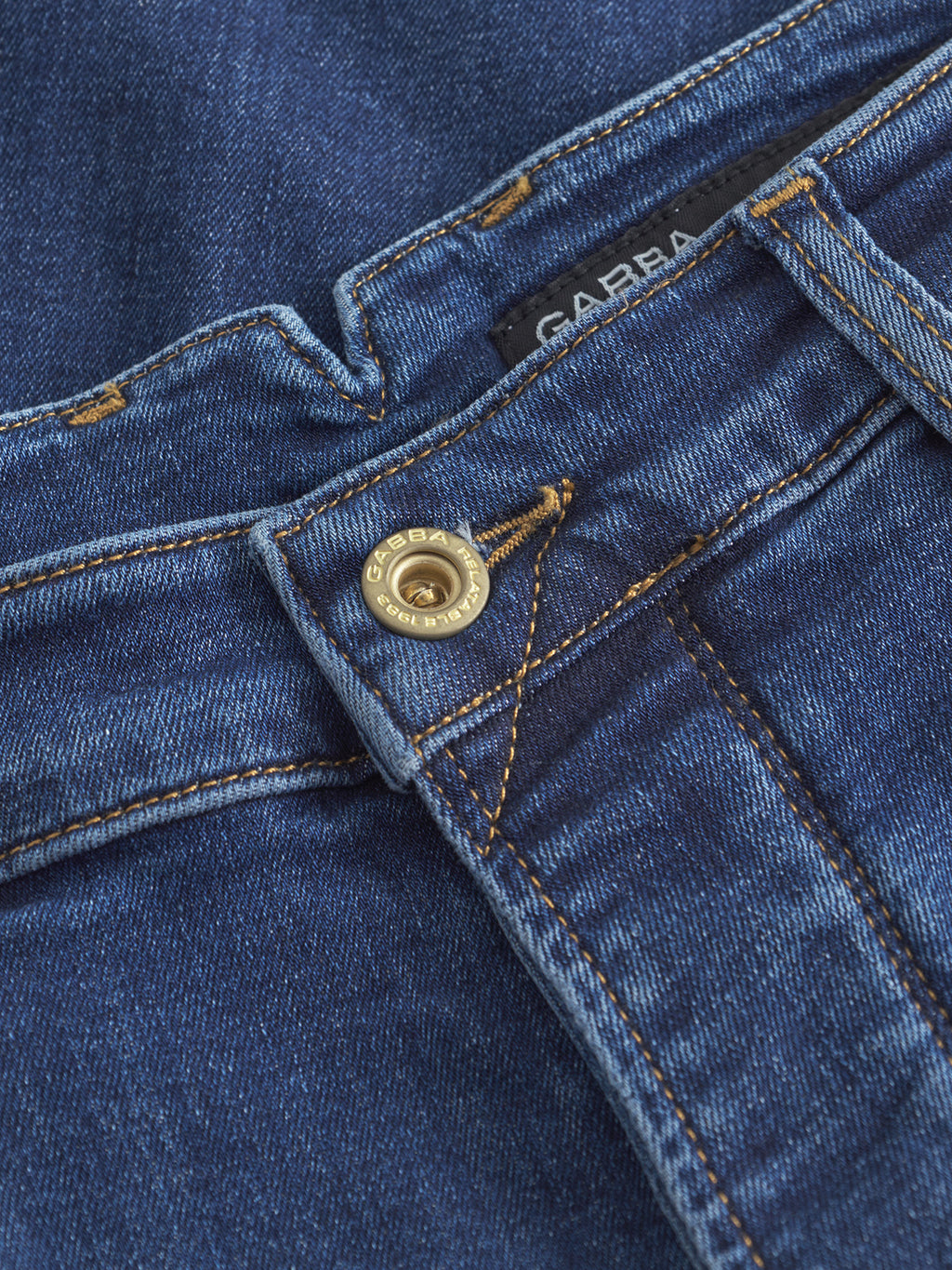 Close-up of Gabbas Alex Just - Dark Blue Denim relaxed tapered jeans, highlighting the waistband, button, zipper, belt loop, visible brand label, and yellow stitching on stretch weave fabric.