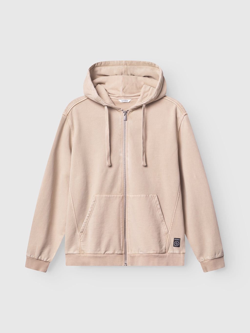The Gabba Delphi Bump GWC - Sand is a beige zip hoodie made from soft jersey, featuring a front pocket, drawstring hood, and a small black patch label—ideal for casual layering on any occasion.