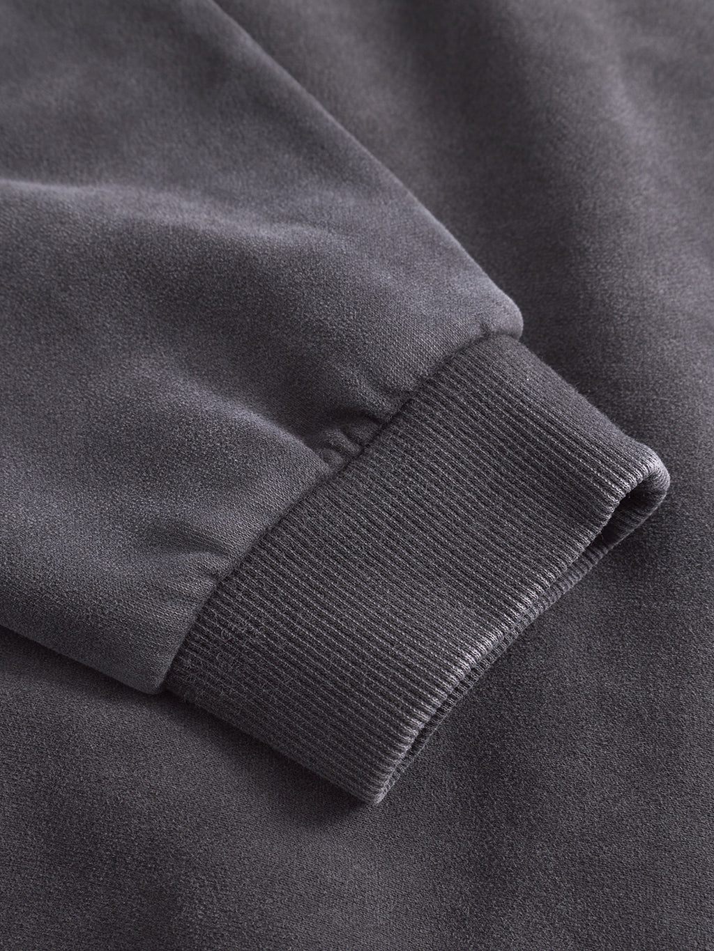 A close-up of the Delphi Bump GWC - Black by Gabba shows its long sleeve cuff, with ribbed fabric at the wrist and ultra-soft material for maximum comfort.
