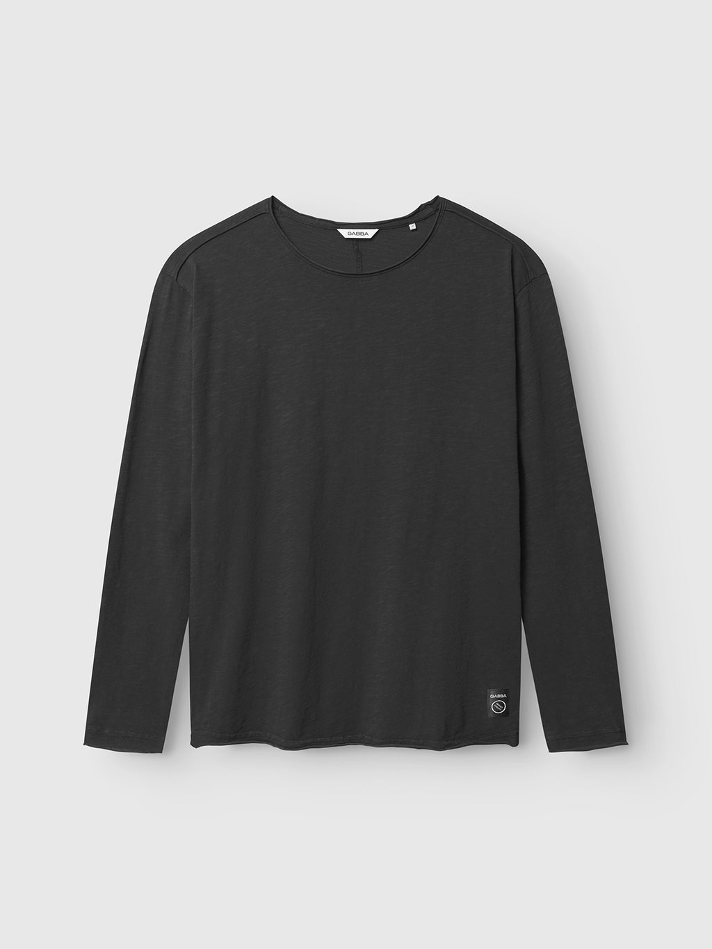 The Gabba Paros Rif GWC - Black is a classic cotton long sleeve tee with a round neckline and a small hem tag, displayed on a light gray background—ideal for everyday wear.