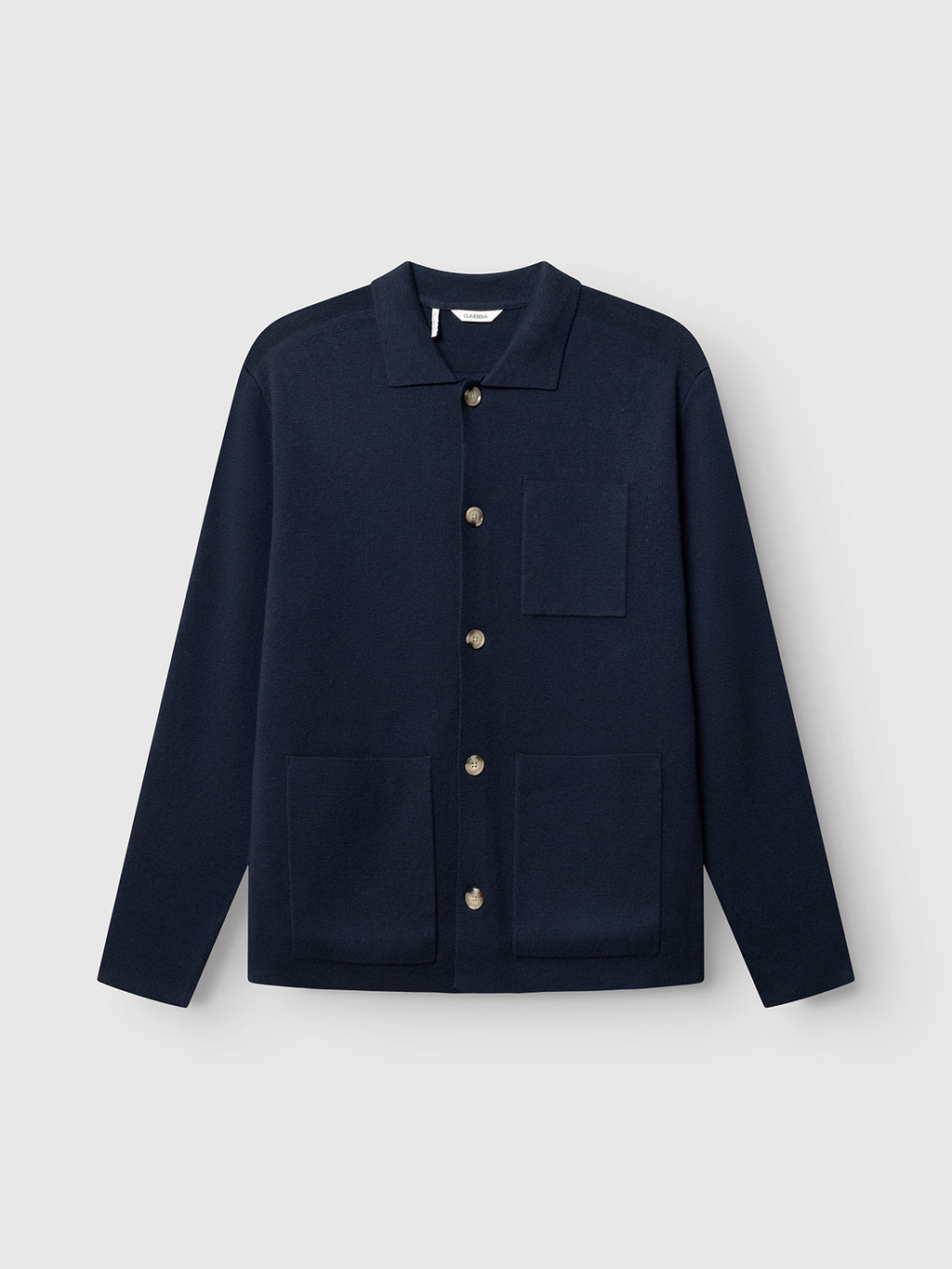 Navy jacket with button details on a light gray background