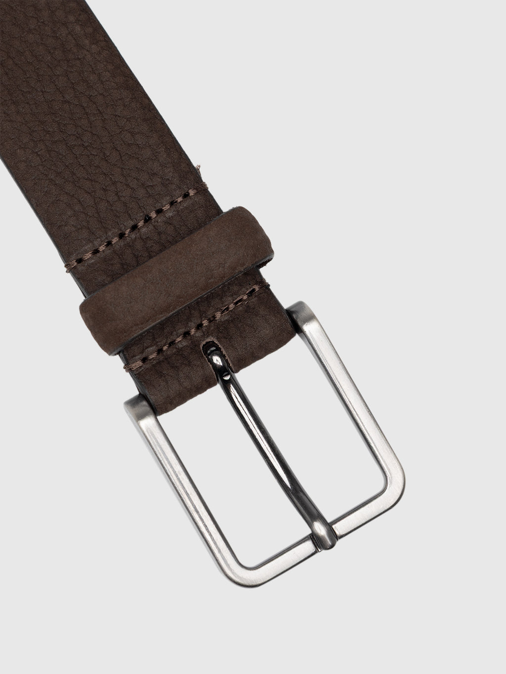 Close-up of the Gabba Buk Belt - Brown, featuring visible stitching and a silver rectangular buckle, displayed against a plain light gray background.