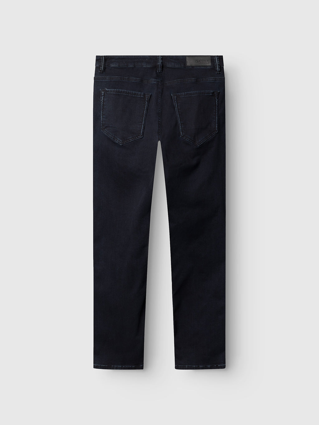 The Gabba Jones BlueBlack jeans in blue-black denim are slim straight fit, shown from the back with two back pockets and a black waistband label. Designed for all-day comfort, theyre displayed against a light gray background.