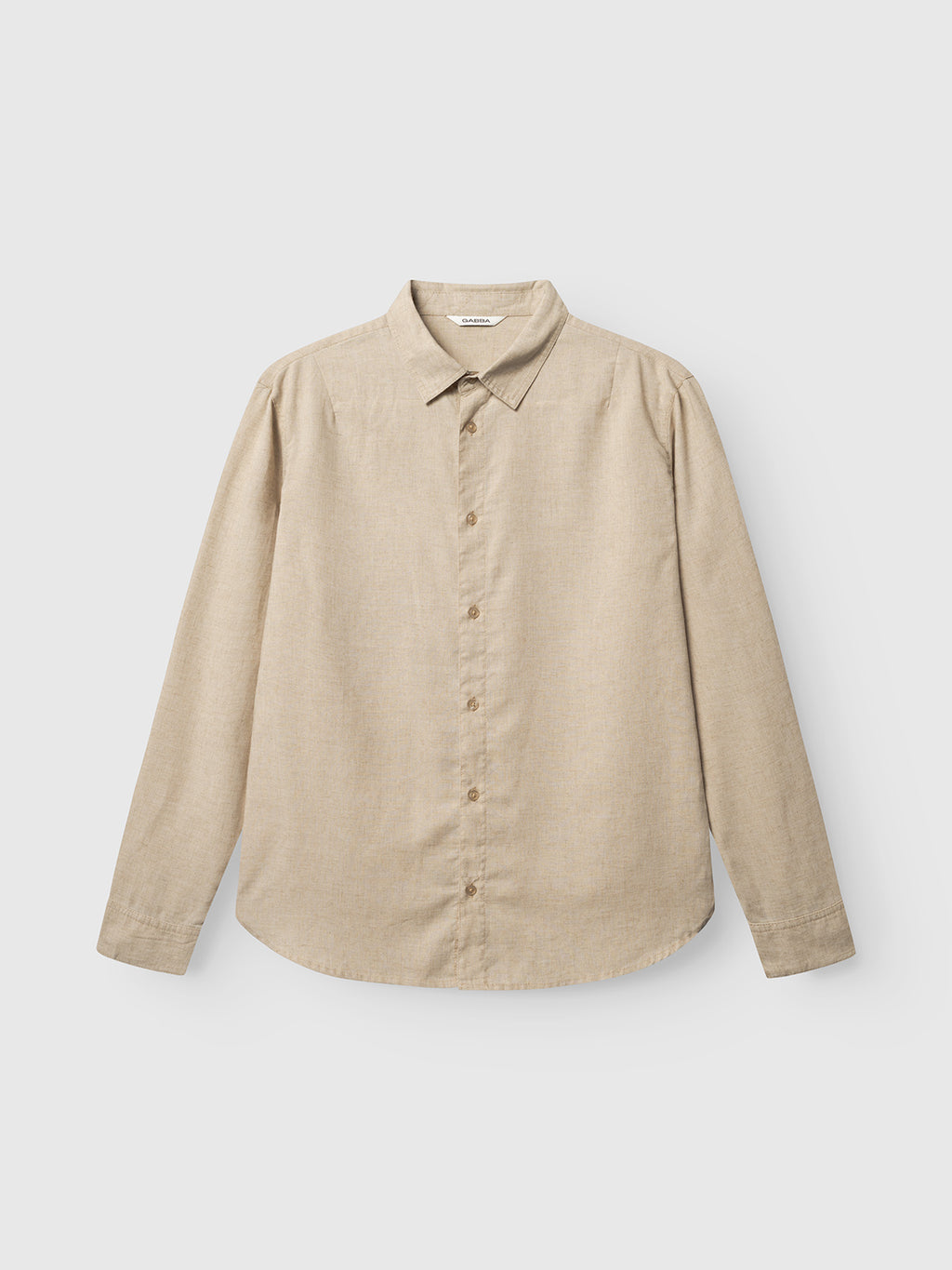 The Gabba GABsven Reg Lins LS Shirt in sand is a beige, long-sleeved linen-blend shirt with a classic collar and button-up front, displayed against a plain white background.