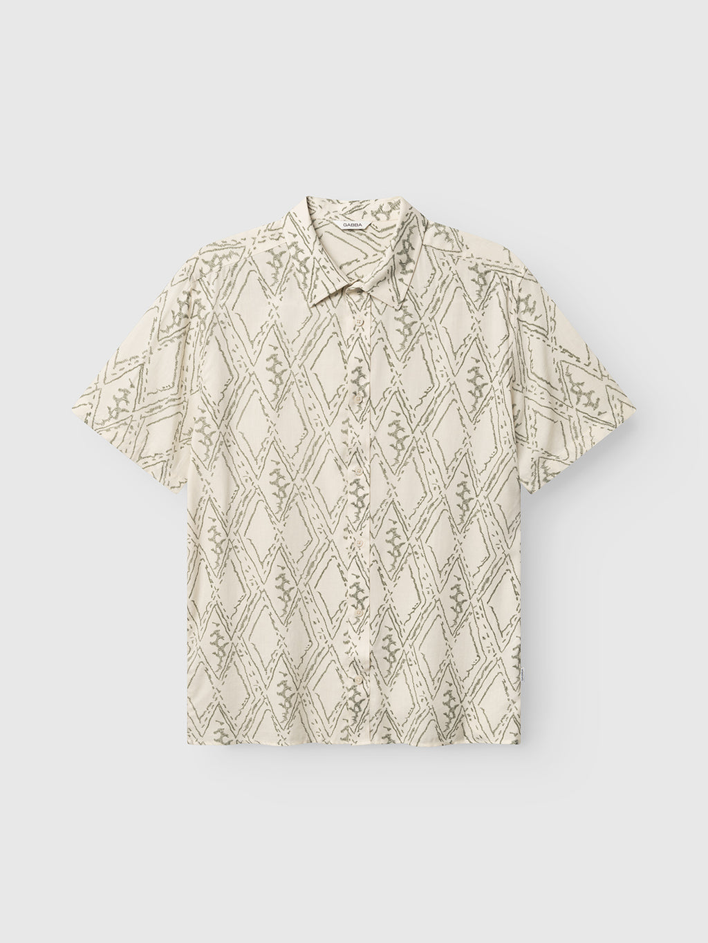 The Gabba GABsven Reg Zag SS Shirt features short sleeves, a regular fit, pointed collar, and a multipattern of abstract diamonds and branch motifs in light gray on beige TENCEL cotton. Laid flat on a white background.