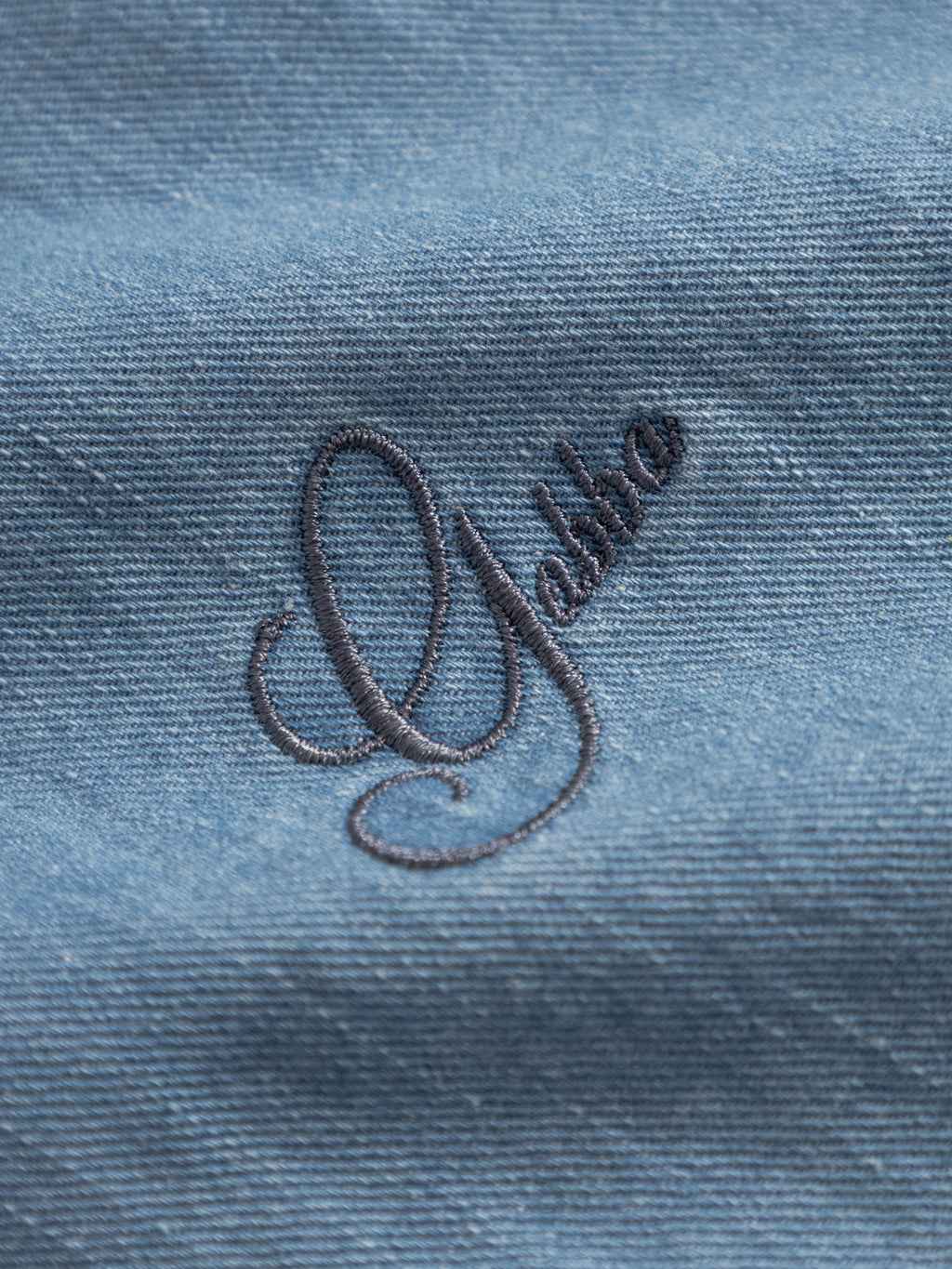 Close-up of the Gabba GABtimo Resort Denim SS Shirt in light denim blue, showing fine ribbed fabric with 