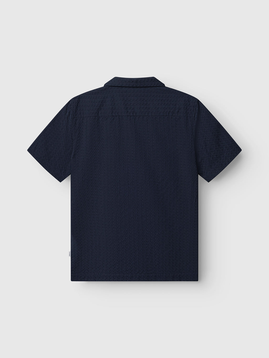 Gabba GABtimo Resort Neal SS Shirt in navy shown from the back, highlighting its textured fabric and classic collar, set against a plain white background.