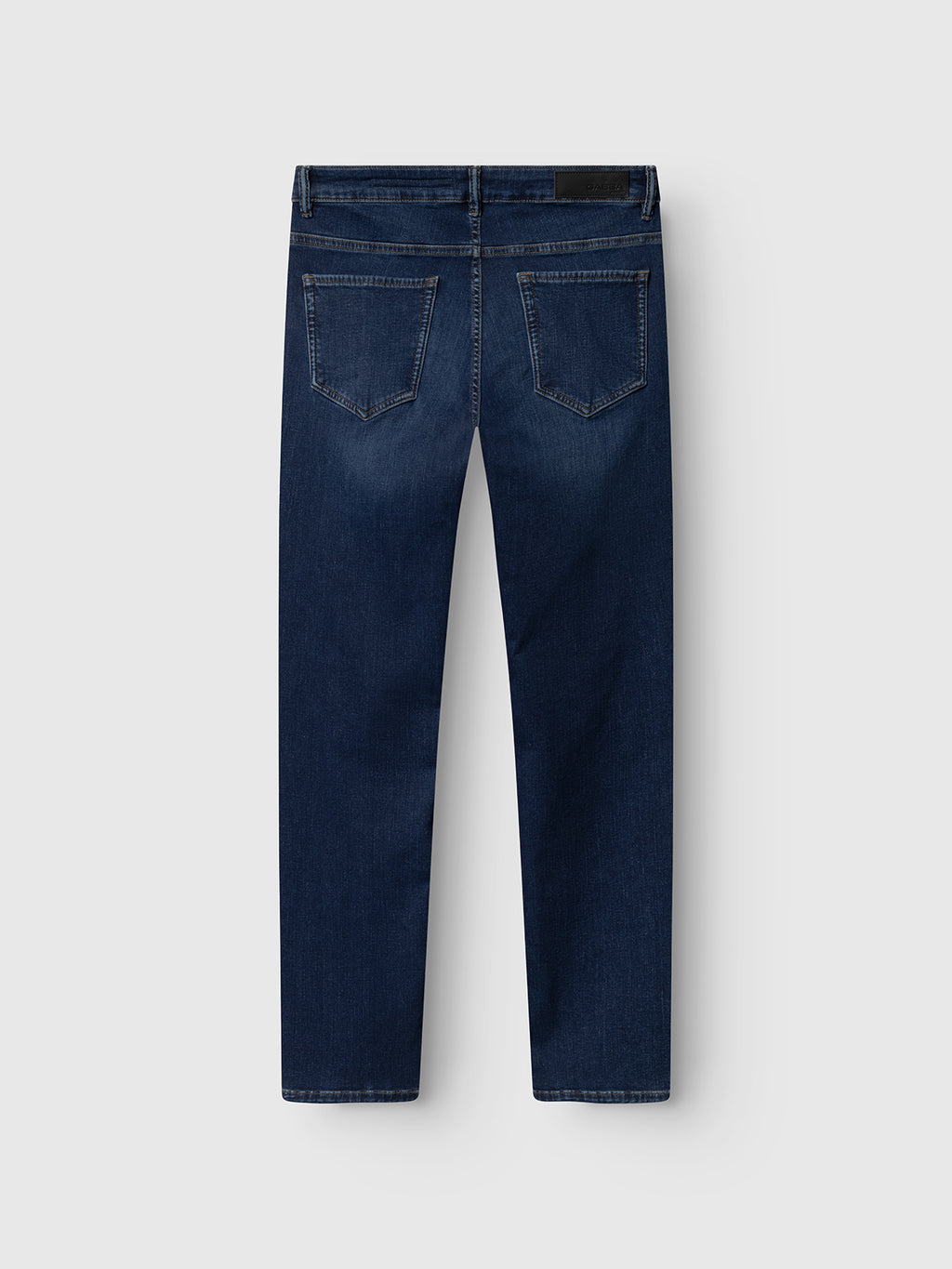 Back view of Gabba GABjones Dhera Jeans in mid blue denim, slim-fit with superstretch fabric, two rear pockets, straight legs, and a black label on the waistband, shown against a plain light gray background.