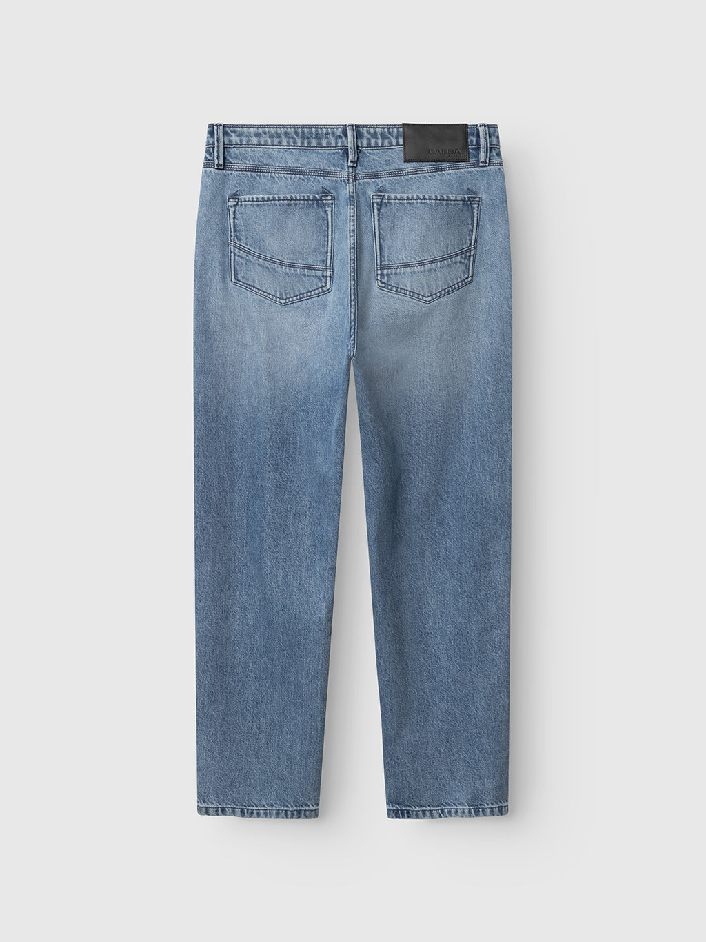The Gabba GABmax Elvis Jeans - Mid Blue Denim are relaxed-fit, light blue jeans in mid stone-wash twill, shown from the back with two back pockets, contrast stitching, and a black waistband patch. Laid flat on a white background.