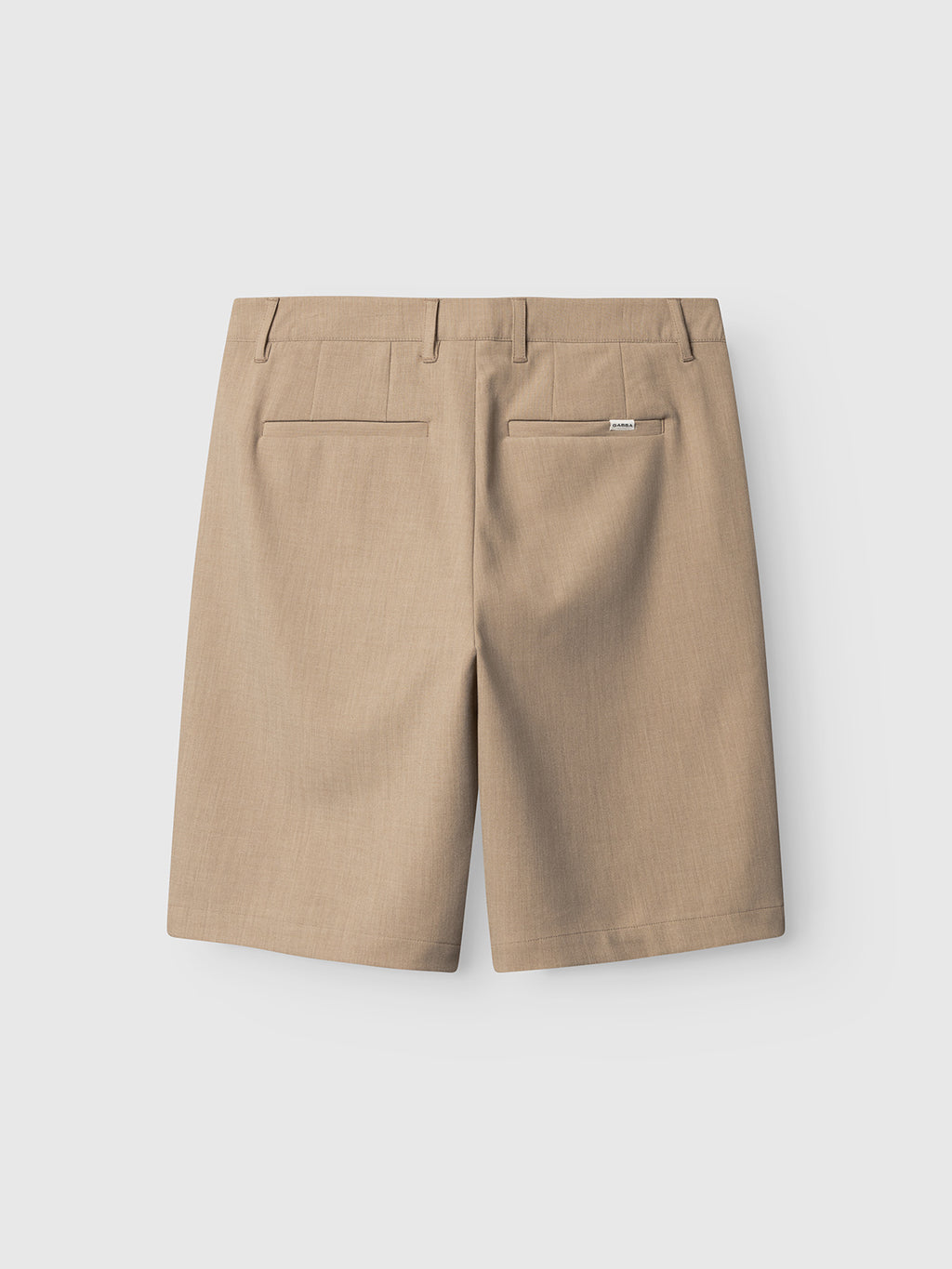 Back view of Gabba GABjoli Pas Phin Shorts GRS in Sand Plaza: beige, knee-length chino shorts with belt loops, two back welt pockets, and a subtle tag above the right pocket, shown on a plain white background.