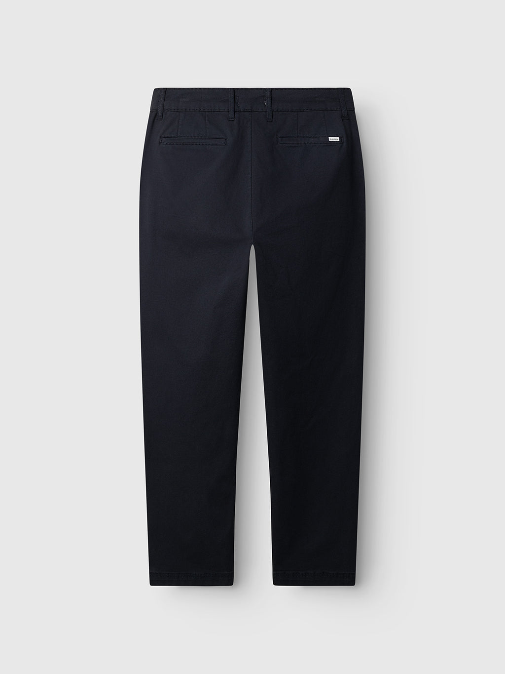 The Gabba GABjoe Nopleats Dale Pant in Blue Black is a pair of tapered-fit chinos with two buttoned back pockets and a branded label above the right pocket, made from high-stretch cotton-blend, shown on a plain light grey background.