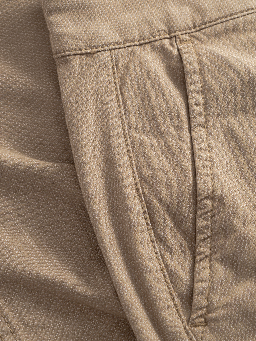 Close-up of Gabba GABjoli Nopleats Dale Shorts in Sand, highlighting the stitched seam, side pocket, and detailed fabric texture.