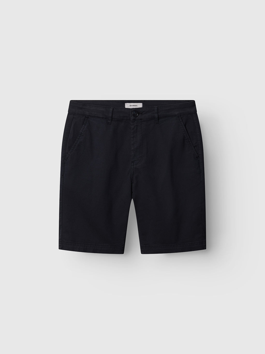 The Gabba GABjoli Nopleats Dale Shorts in blue black are neatly folded, featuring front pockets and belt loops, displayed on a plain light gray background.