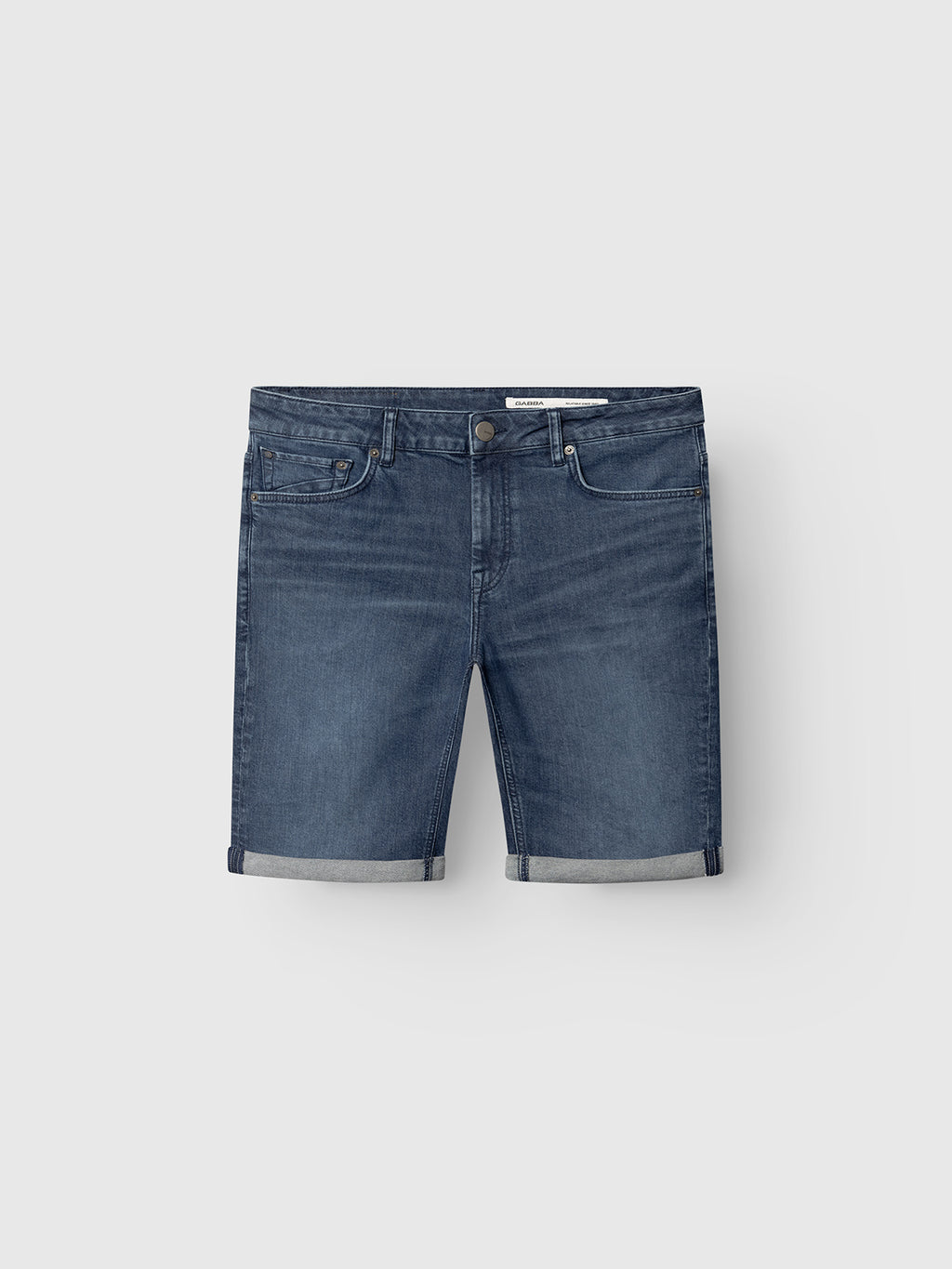The Gabba GABmarkus Derby Shorts in denim wash feature comfort-stretch denim, a classic 5-pocket design, button and zip closure, and rolled-up hems. They are displayed against a light gray background.