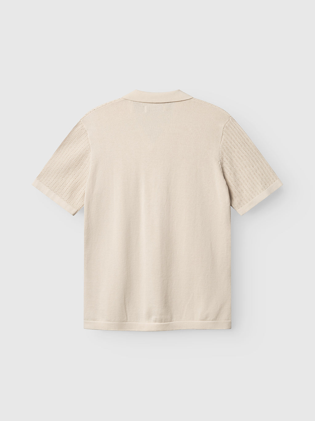 The Gabba GABgeno Resort Bride SS Knit in Birch is displayed flat with the back facing up, featuring a plain back, textured ribbed sleeves, and a subtle collar.