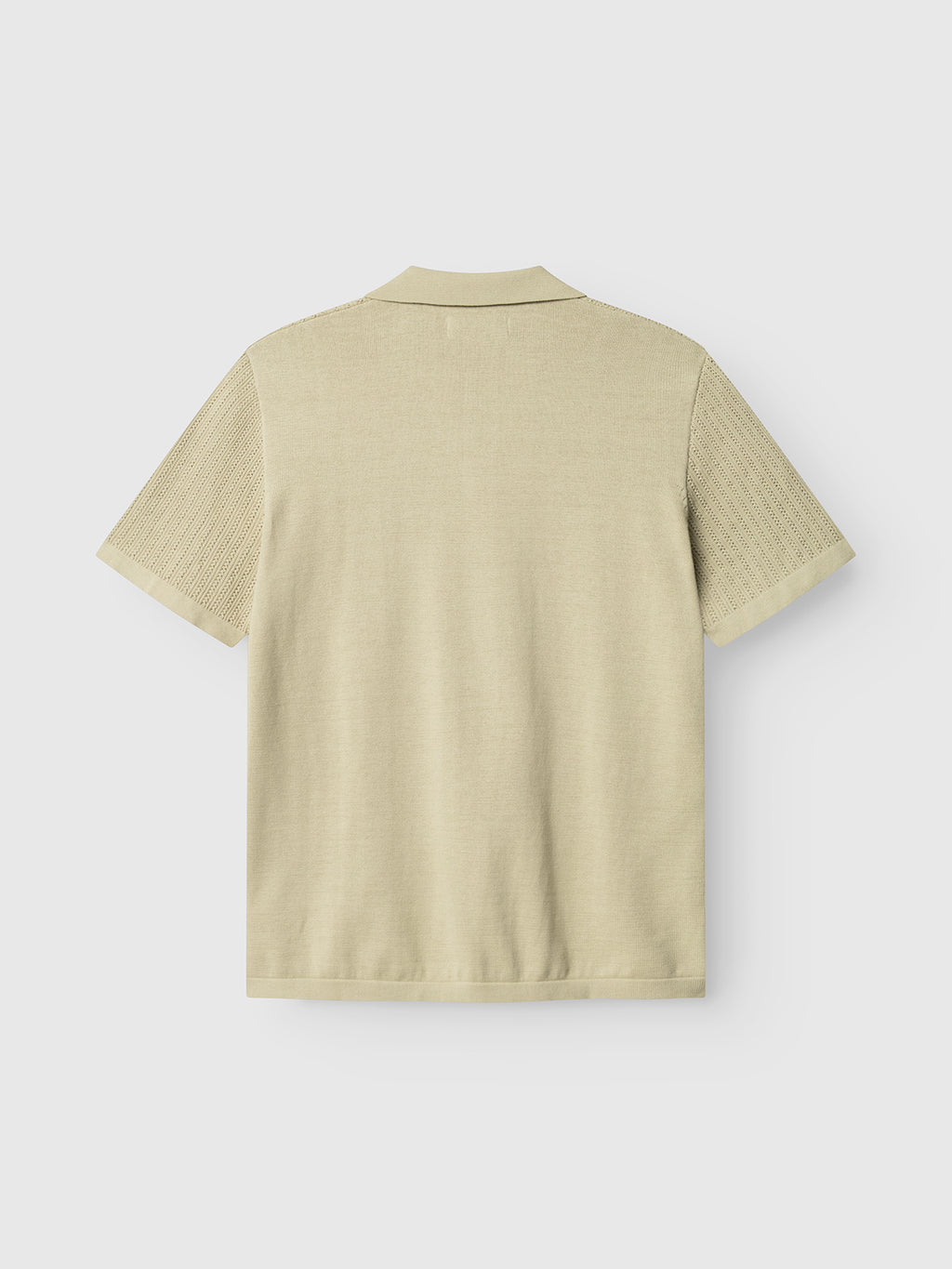 The Gabba GABgeno Resort Bride SS Knit in light green is displayed from the back, with a flat collar and ribbed short sleeves, laid flat on a plain white background.