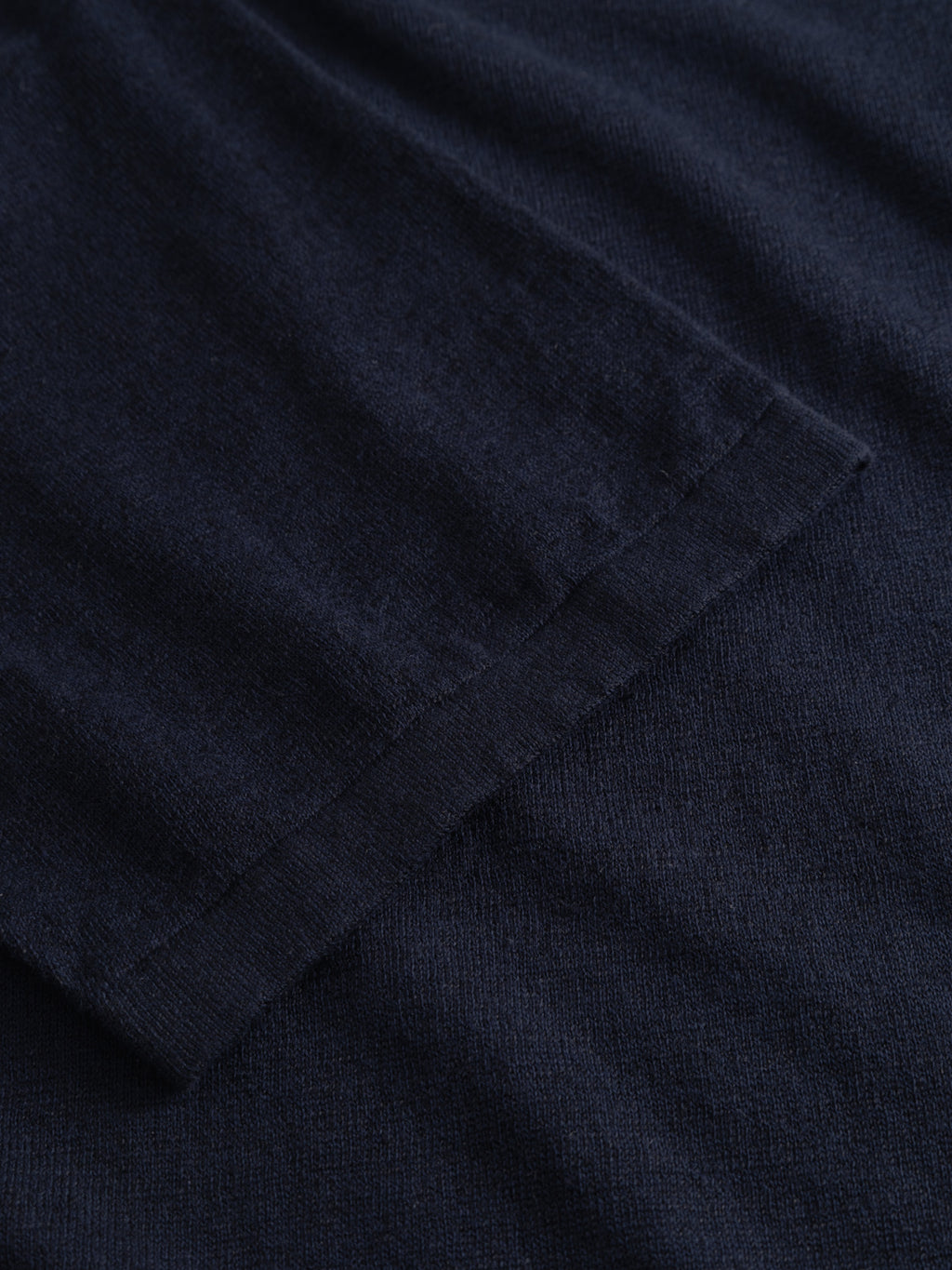 Close-up of the Gabba GABvento Dush SS Knits in navy, highlighting the soft, textured fabric and detailed stitching along the edge of this oversized short-sleeve shirt.